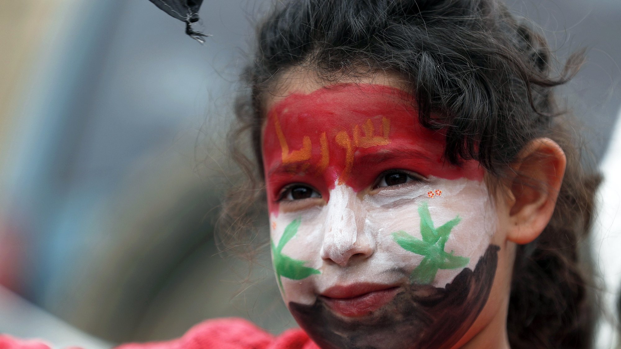 epa07458517 A young Druze girl with her face painted in Syrian flag attends a protest against US President Trump announcements to Recognize Israel&#039;s Sovereignty over Occupied Golan Heights, in the Druze village of Majdal Shams, located on the Israeli-Syrian border, 23 March 2019. US President Trump said in a tweet on 21 March 2019, that &#039;it is time for the United States to fully recognize Israel&#039;s Sovereignty over the Golan Heights&#039; adding that it is of &#039;critical strategic and security importance to the State of Israel and Regional Stability.&#039; Israel captured much of the Golan region from Syria in 1967 and then annexed it in 1981, a move that was never international recognized. Trump&#039;s remarks came as US Secretary of State Pompeo is on a trip in the Middle East and visited Jerusalem on the day.  EPA/ATEF SAFADI