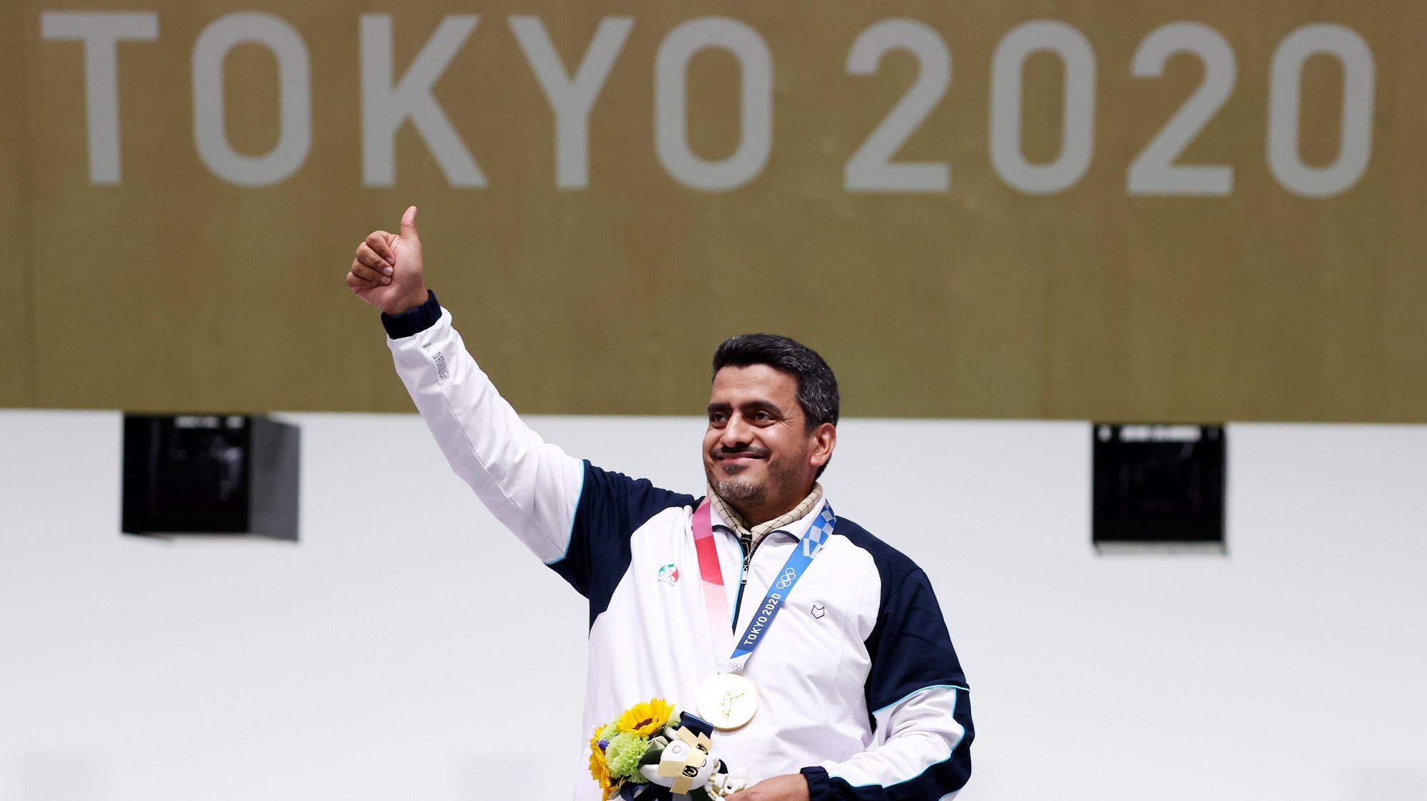 epa09361145 Gold medalist Javad Foroughi of Iran during medal ceremony for the Men&#039;s 10m Air Pistol final during the Shooting events of the Tokyo 2020 Olympic Games at the Camp Asaka in Nerima, Tokyo, Japan, 24 July 2021.  EPA/Michael Reynolds