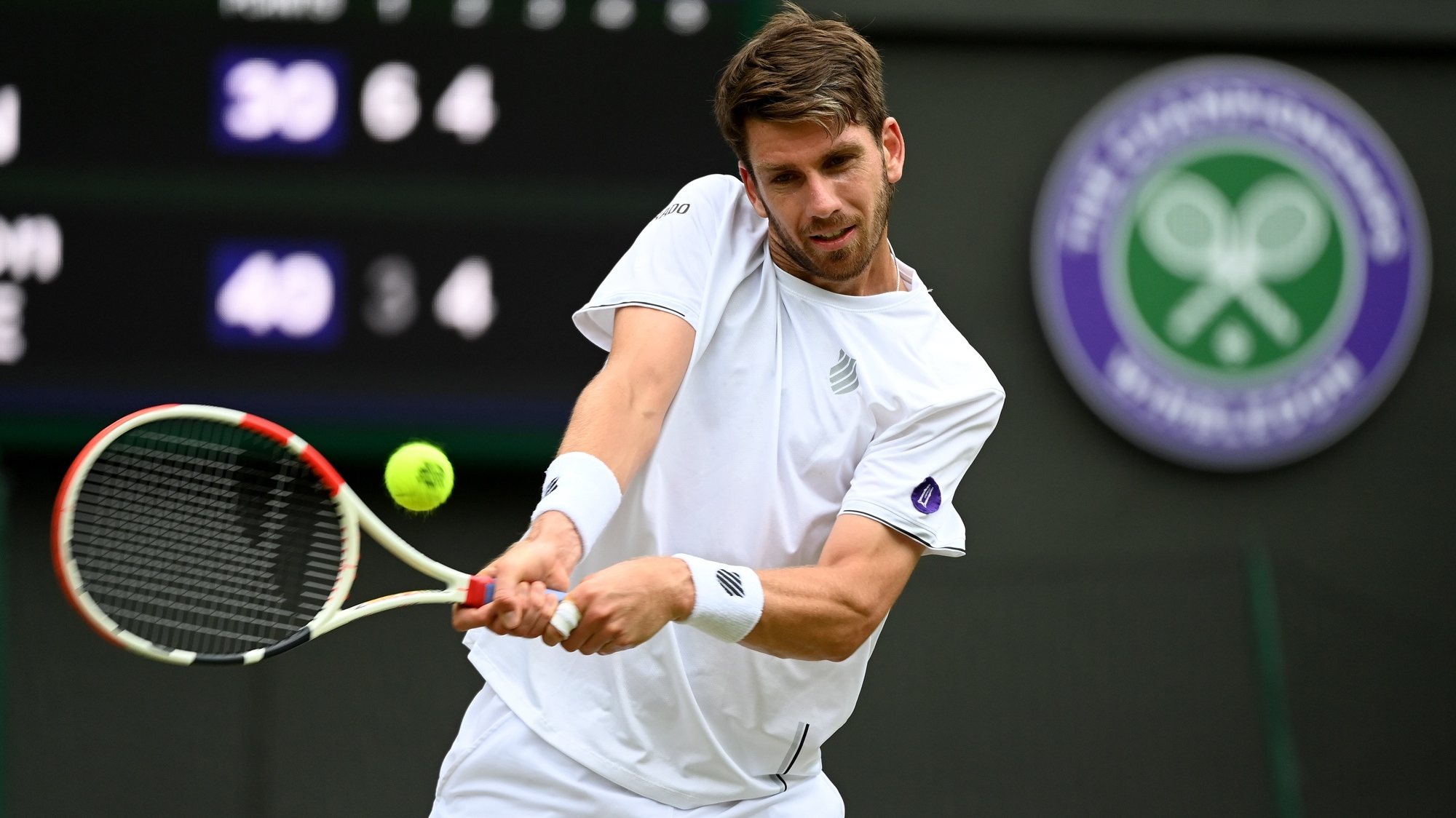 epa10053731 Cameron Norrie of Great Britain in action in the men&#039;s quarter final match against David Goffin of Belgium at the Wimbledon Championships, in Wimbledon, Britain, 05 July 2022.  EPA/ANDY RAIN   EDITORIAL USE ONLY