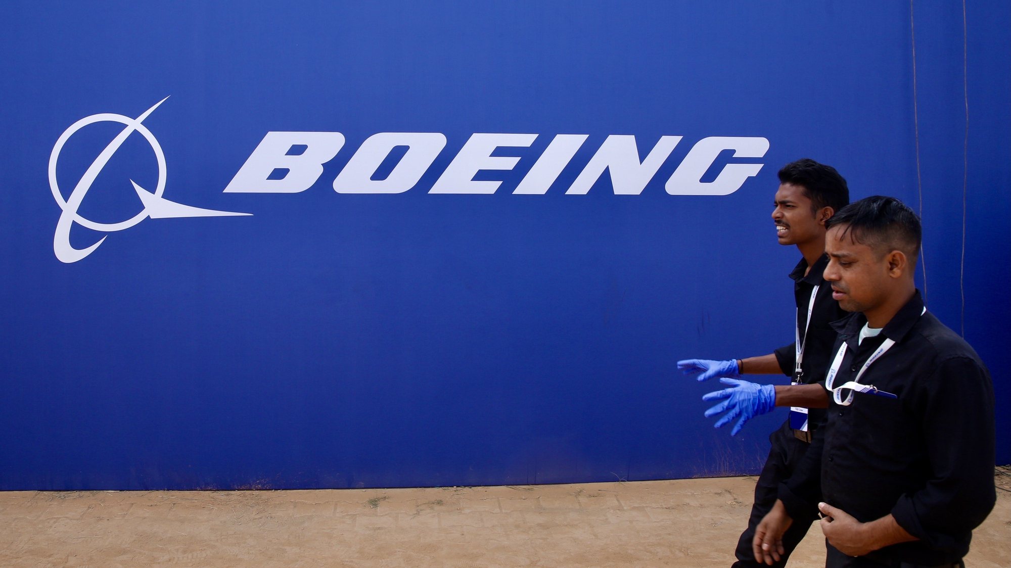 epa11090126 Boeing employees walks infront of the Logo during the inaugural event of Boeing’s aerospace engineering facility and technology centre campus and &#039;Boeing Sukanya Programme&#039; that &#039;aims to support the entry of more girl children from across India into the country&#039;s growing aviation sector&#039; in Bangalore, India, 19 January 2024. The Boeing India Engineering &amp; Technology Center (BIETC) campus is the largest aerospace engineering facility outside the United States with 43-acre and the centre has been built for Rs 1,600 crore (192,530,24 USD), where Boeing India has grown over 6,000 engineering and Research and Development talent employees in any country outside the United States.  EPA/JAGADEESH NV