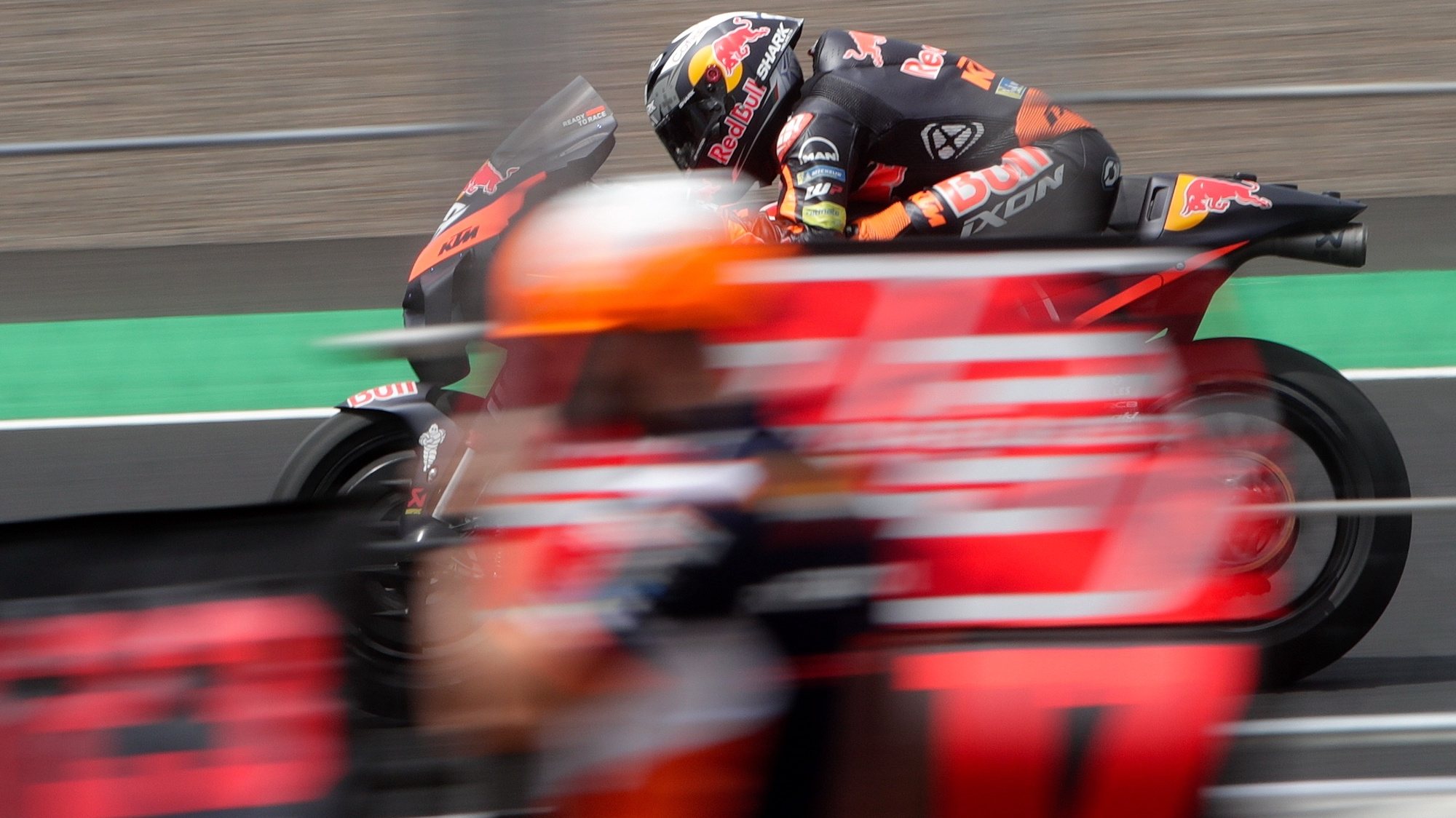 epa09837297 Portuguese MotoGP rider Miguel Oliveira  of the Red Bull KTM Factory Racing Team in action during a warm up session of the Motorcycling Grand Prix of Indonesia at the Pertamina Mandalika International street circuit in Lombok, Indonesia, 20 March 2022  EPA/ADI WEDA