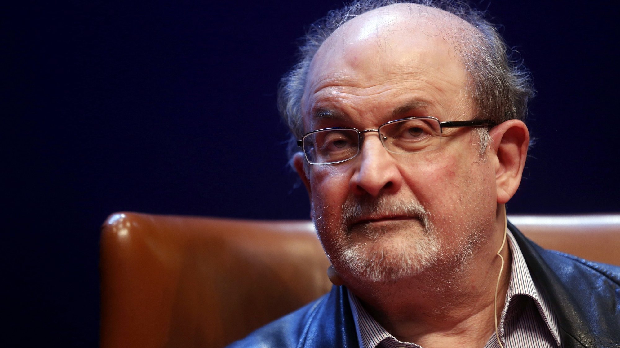 epa10117473 (FILE) - Indian-British writer Salman Rushdie presents his book &#039;Two Years Eight Months and Twenty-Eight Nights&#039; in Aviles, Spain, 07 October 2015 (reissued 12 August 2022). Rushdie and an interviewer were attacked while on stage at an event in Chautauqua, New York State, USA, on 12 August 2022. The suspect was taken into custody, New York State police said. Rushdie, who was apparently stabbed in the neck, was transported to a hospital. His condition is not yet known.  EPA/JL CEREIJIDO *** Local Caption *** 53580620