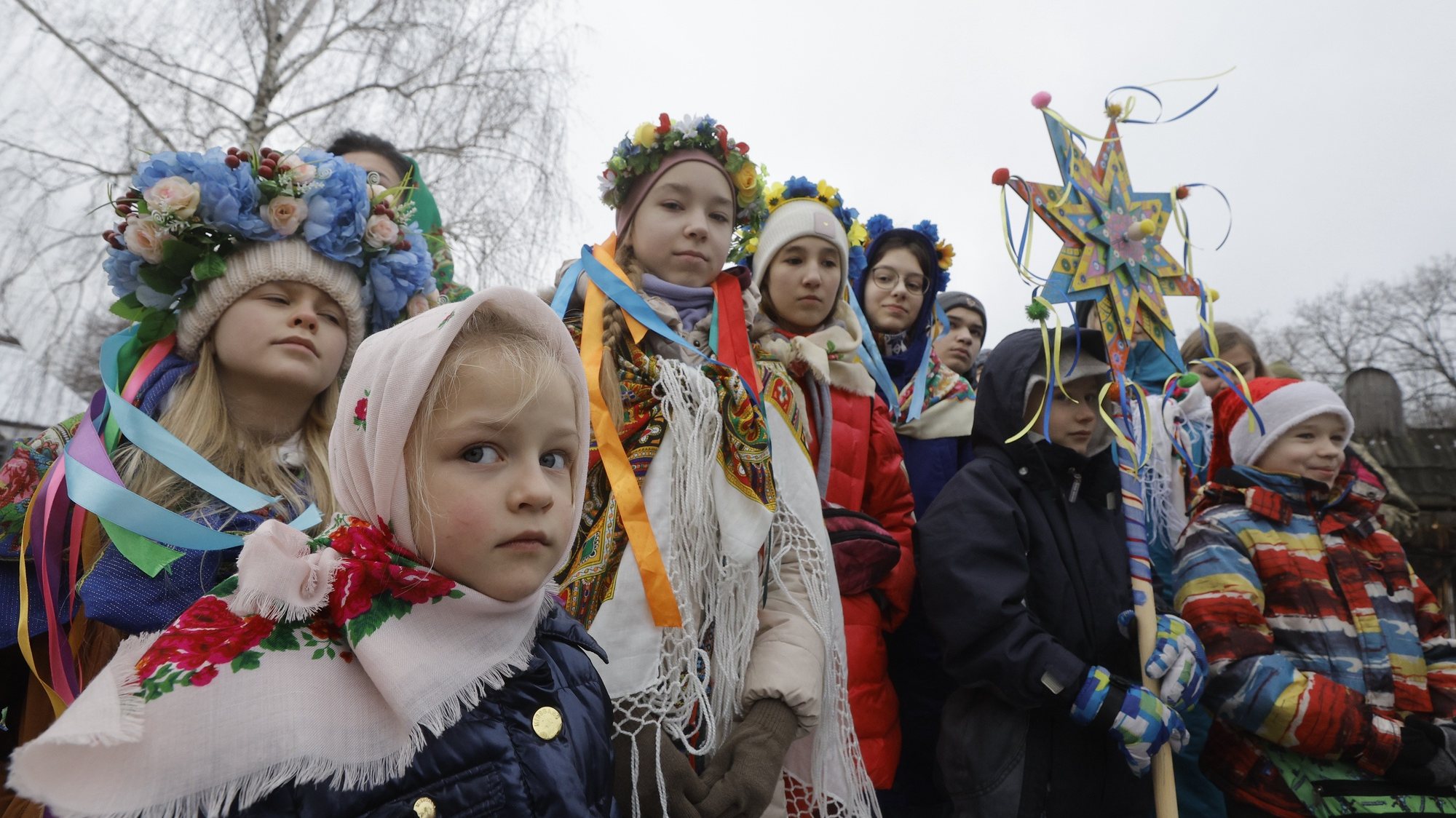 epa11044034 Ukrainian children wearing traditional attire sing Christmas carols as they walk from house to house in Pyrogovo village, near Kyiv (Kiev), Ukraine, 25 December 2023, amid the Russian invasion. Ukraine celebrates Christmas on 25 December for the first time this year, in accordance with the Western calendar. Ukrainian President Zelensky signed a law in July to move the official Christmas Day holiday to 25 December, departing from the Russian Orthodox Church tradition of celebrating on 07 January. Russian troops entered Ukraine on 24 February 2022 starting a conflict that has provoked destruction and a humanitarian crisis.  EPA/SERGEY DOLZHENKO