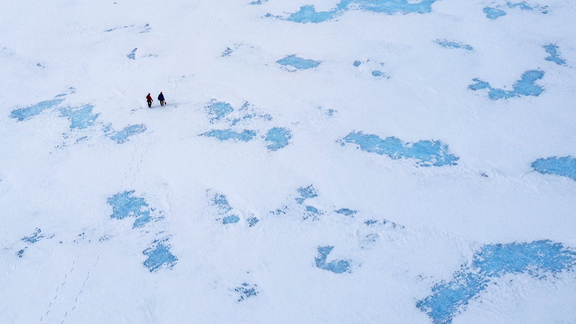 epa08429217 Two scientists walk on blue ice around Rossman Cove near the Glaciar Union camp in the Ellsworth Mountains, Antarctica, 25 November 2018 (re-issued 18 May 2020). As prominent in both sky and sea, the color blue is often associated with open spaces, freedom, depth and wisdom. In psychology blue is viewed as a non-threatening color and it is believed to have positive and calming effects on body and mind. Often linked with intellect, confidence and reliability, it is known in corporate America as a power color.  EPA/FELIPE TRUEBA ATTENTION: This Image is part of a PHOTO SET *** Local Caption *** 54951400