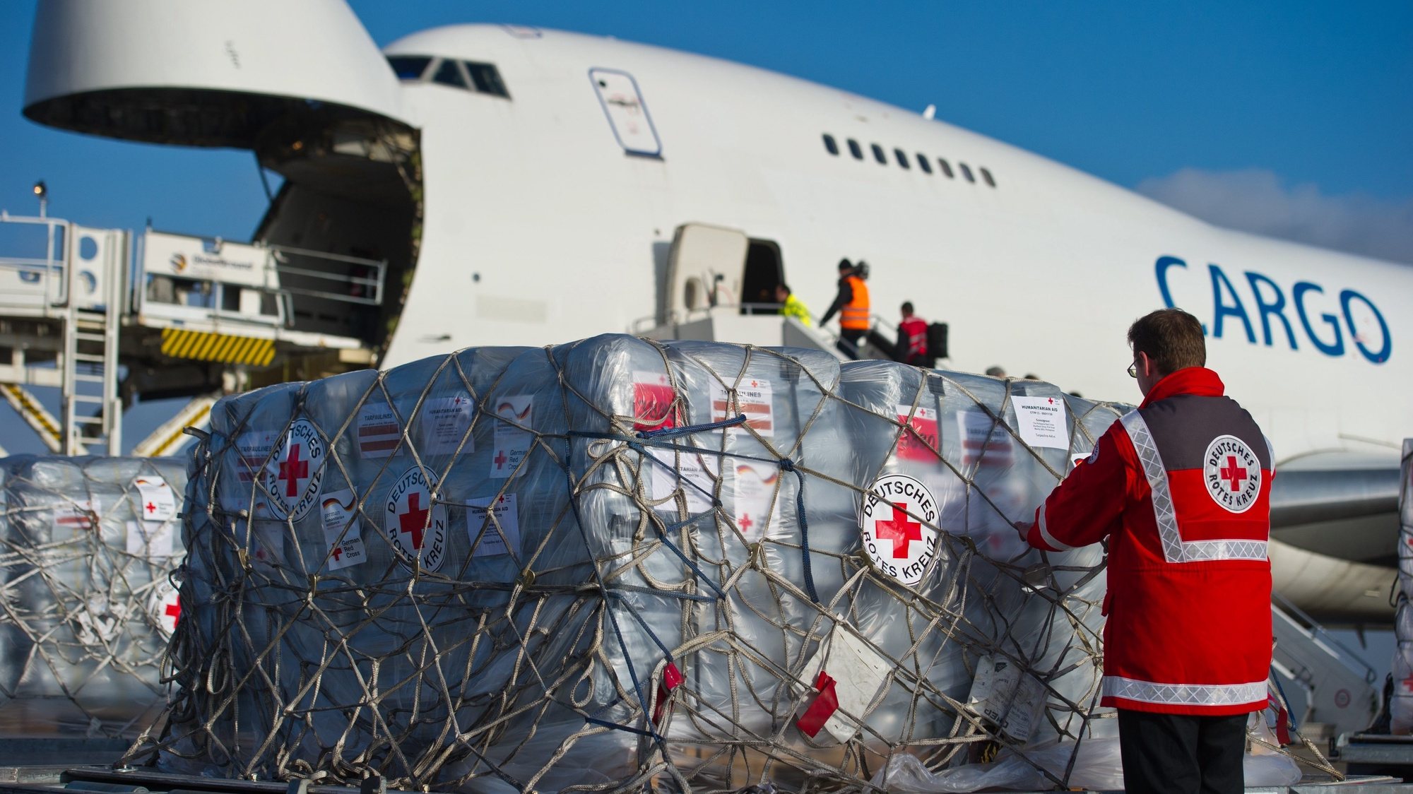 epa03947921 Relief supplies for the victims of the typhoon in the Philippines are loaded into an aircraft at Schoenfeld Airport in Schoenefeld, Germany, 13 November 2013. 70 tons of freight are sent by the German Red Cross and the Federal Agency for Technical Relief to the Cebu region that has been hit the worst by the typhoon.  EPA/PATRICK PLEUL