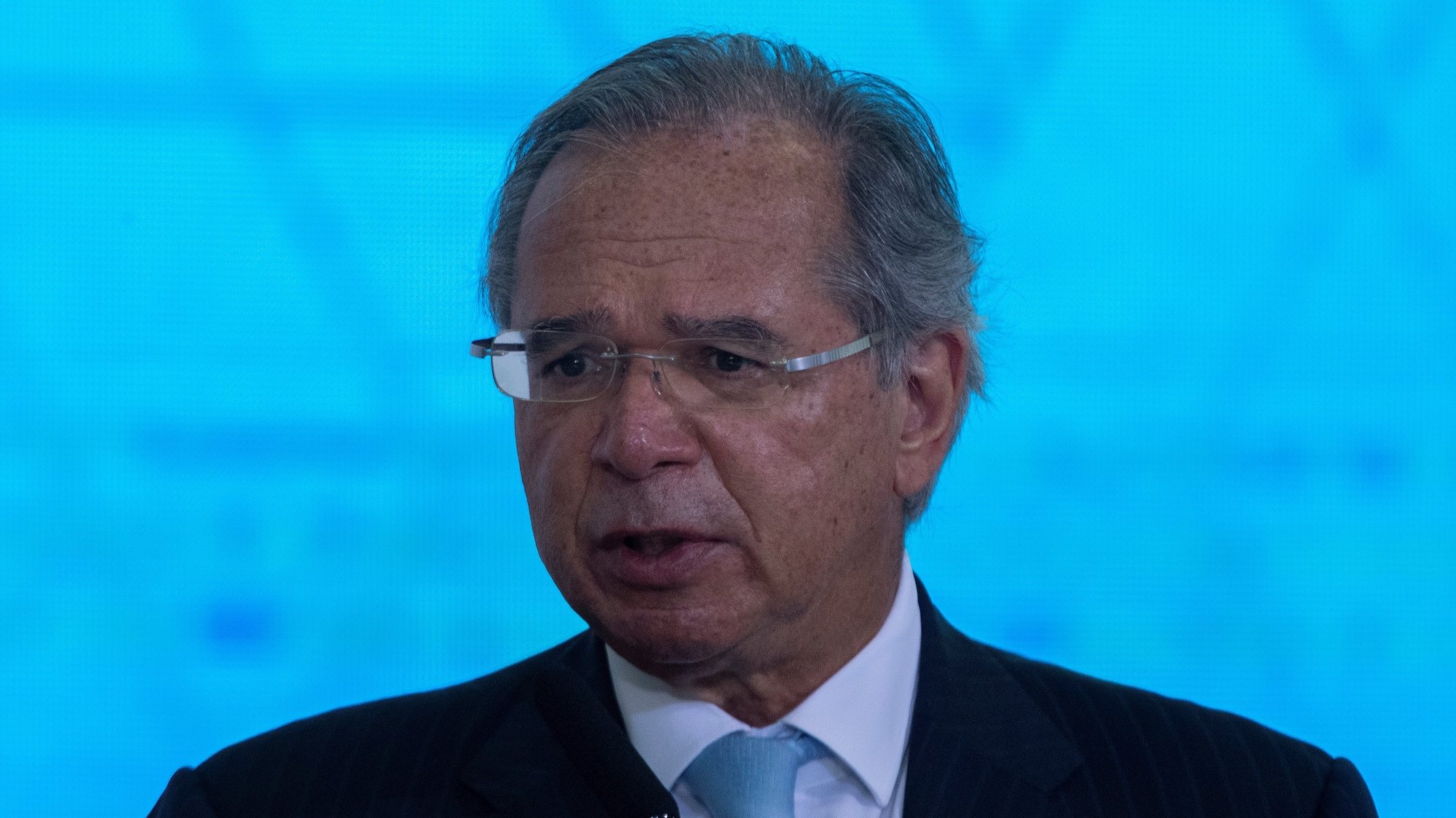 epa09343161 The Brazilian Minister of Economy, Paulo Guedes, speaks during the sanction ceremony of the Eletrobras Capitalization Law, at the Planalto Palace in Brasilia, Brazil, 13 July 2021. Bolsonaro sanctioned with some vetoes the Provisional Measure that regulates the privatization process of the state giant Eletrobras, the largest electricity company in Latin America, according to the Official Gazette of the Union published on 13 July.  EPA/Joedson Alves