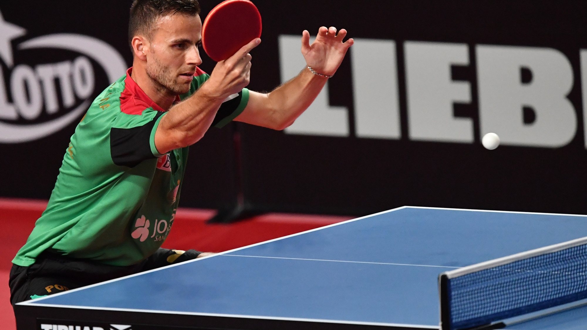 epa09301850 Tiago Apolonia of Portugal in action against Jon Persson of Sweden in the men&#039;s singles qualifiers during the ITTF European Table Tennis Championships 2020 in Warsaw, Poland, 25 June 2021.  EPA/Piotr Nowak POLAND OUT