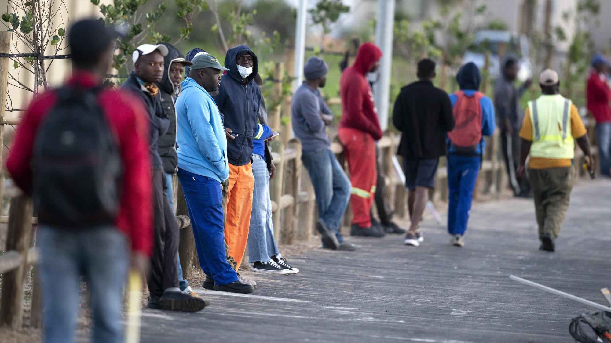 epa08508009 Men wait for work in the informal sector with around 200 other job seekers at a road junction in Cape Town, South Africa, 24 June 2020 (issued 25 June 2020). According to a report released this week by Statistics South Africa the unemployment rate has reached a record high level of 30.1 percent up from 29.1 percent in the final quarter of last year. Africa&#039;s biggest economy was in recession before the coronavirus pandemic but lockdowns have further negatively impacted businesses and employment opportunities. The informal sector provides employment to approximately 30 percent of South African workers according to the World Bank. Cape Town is the countries epicenter of coronavirus SARS-CoV-2 which causes the Covid-19 disease.  EPA/NIC BOTHMA ATTENTION: This Image is part of a PHOTO SET
