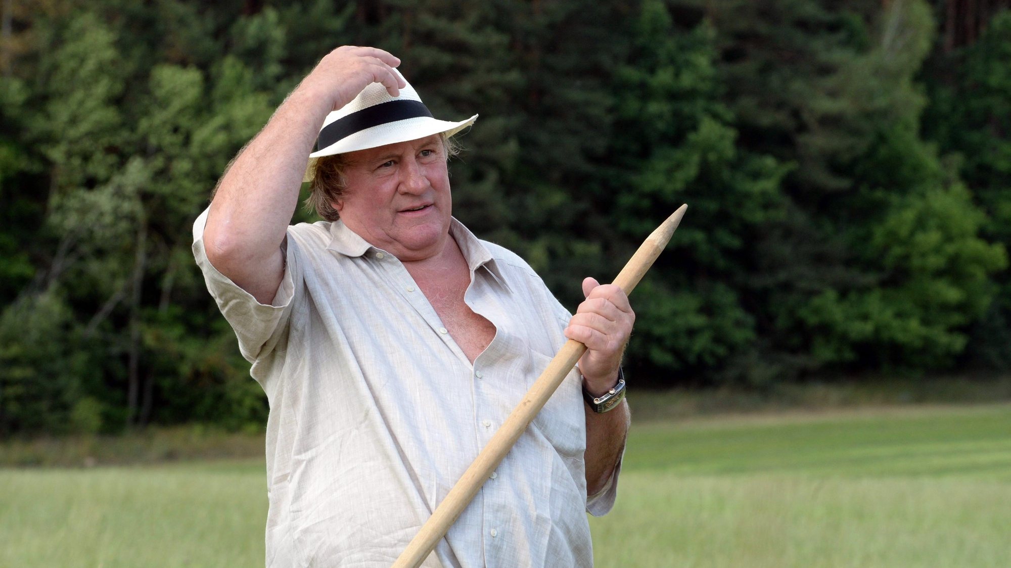 epa09032153 (FILE) - French actor Gerard Depardieu participates in hand-scything on the territory of the Ozerny official presidential residence outside Minsk, Belarus, 22 July 2015  (reissued 23 February 2021). French media citing judicial sources report on 23 February 2021 that Depardieu has been charged with rape. The French actor had already been accused of rape and sexual assault in 2018.  EPA/ANDREI STASEVICH POOL *** Local Caption *** 54851032