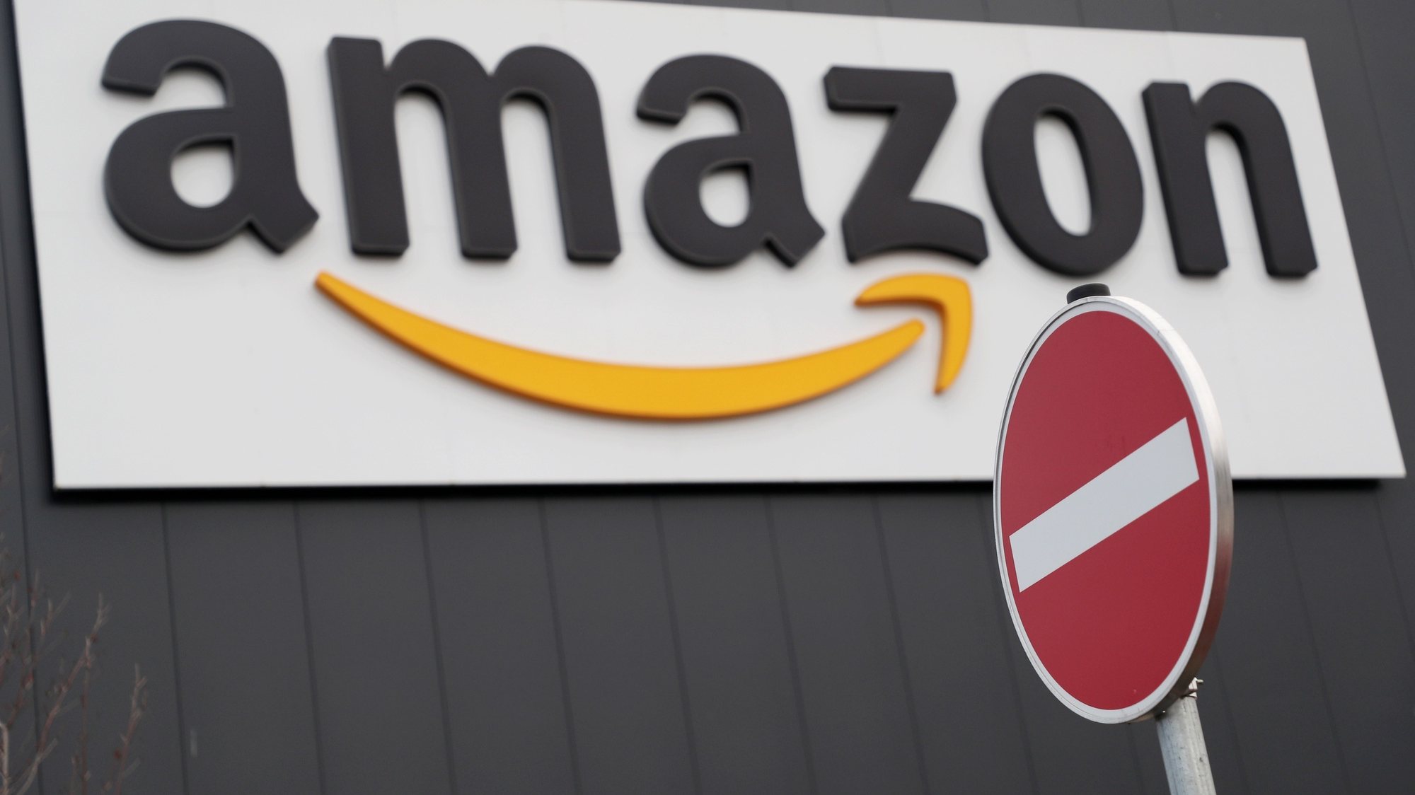 epa08478451 (FILE) - The Amazon logo is pictured outside the company&#039;s logistic and distribution center in Werne, Germany, 22 November 2018 (reissued 10 June 2020). Amazon Web Services (AWS) announced on 10 June that it will ban cops from using its facial recognition technology &#039;Amazon Rekognition&#039; for one year, in wake of the ongoing protests against police abuse following the death of George Floyd in Minneapolis, Minnesota.  EPA/FRIEDEMANN VOGEL