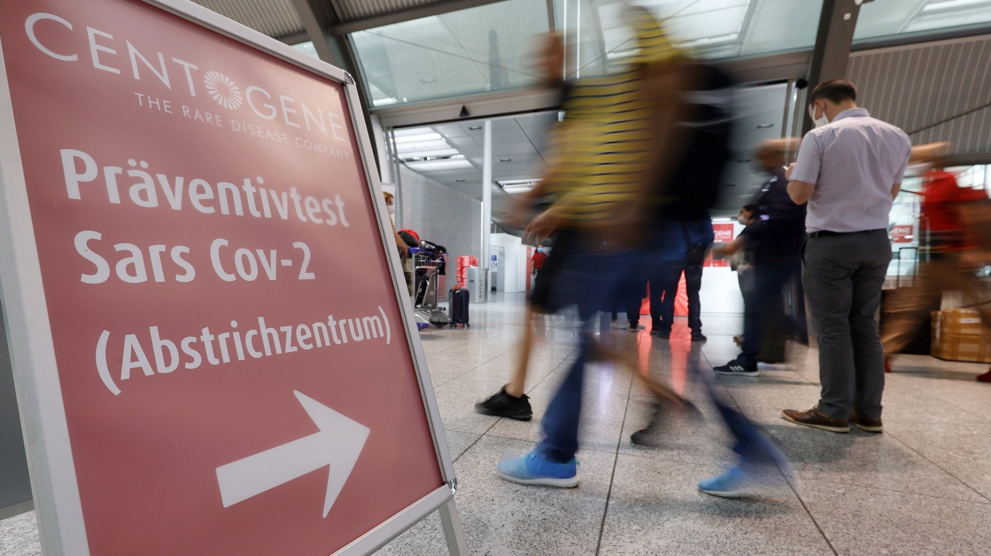 epa08564117 (FILE) - A sign in front of the diagnostics provider Centogene in Germany&#039;s first walk-in test center for corona viruses (COVID-19) at an airport at Frankfurt International Airport, Germany, 30 June 2020 as Germany&#039;s first walk-in test center at an airport for coronavirus disease (COVID-19) opened (reissued 24 July 2020). Reports on 24 July 2020 state German Health Minister Jens Spahn saying the current infection numbers show the country is still in the middle of  Coronavirus pandemic. Increased numbers of travellers may cause the numbers of new infections to rise, and the government has decided that all arrivals can have themselves tested within three days after entering Germany.  EPA/RONALD WITTEK *** Local Caption *** 56185900