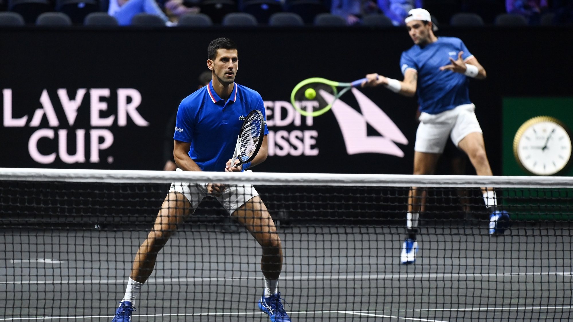 epa10204468 Novak Djokovic of Team Europe (L) with term mate Matteo Berrettini (R) during their Laver Cup doubles match against Alex De Minaur and Jack Sock of Team World at the O2 Arena in London, Britain, 24 September 2022.  EPA/ANDY RAIN