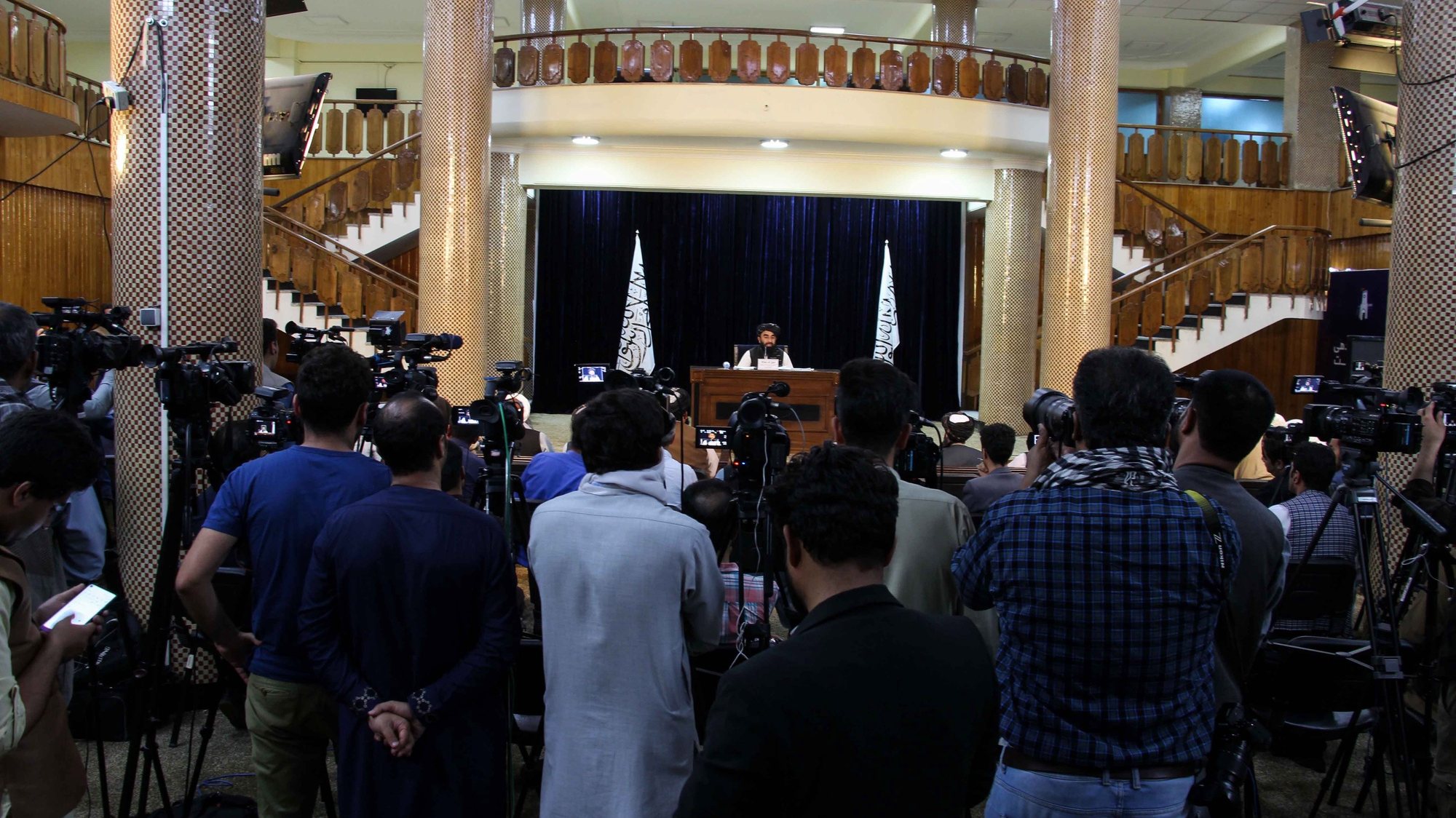 epa09453992 Zabhiullah Mujahid, the Taliban spokesperson, talks with journalists as he announces the interim government and declaring the country as an Islamic Emirate, during a press conference in Kabul, Afghanistan, 07 September 2021. Mujahid said the government will be led by Mullah Mohammad Hassan Akhund, with Sarajuddin Haqqani as the Interior Minister. Mullah Yaqoob as acting Defence Minister, Amir Khan Muttaqi as acting Foreign Minister, and Taliban co-founder Mullah Abdul Ghani Baradar and Mullah Abdul Salam Hanafi as two deputies.  EPA/STRINGER
