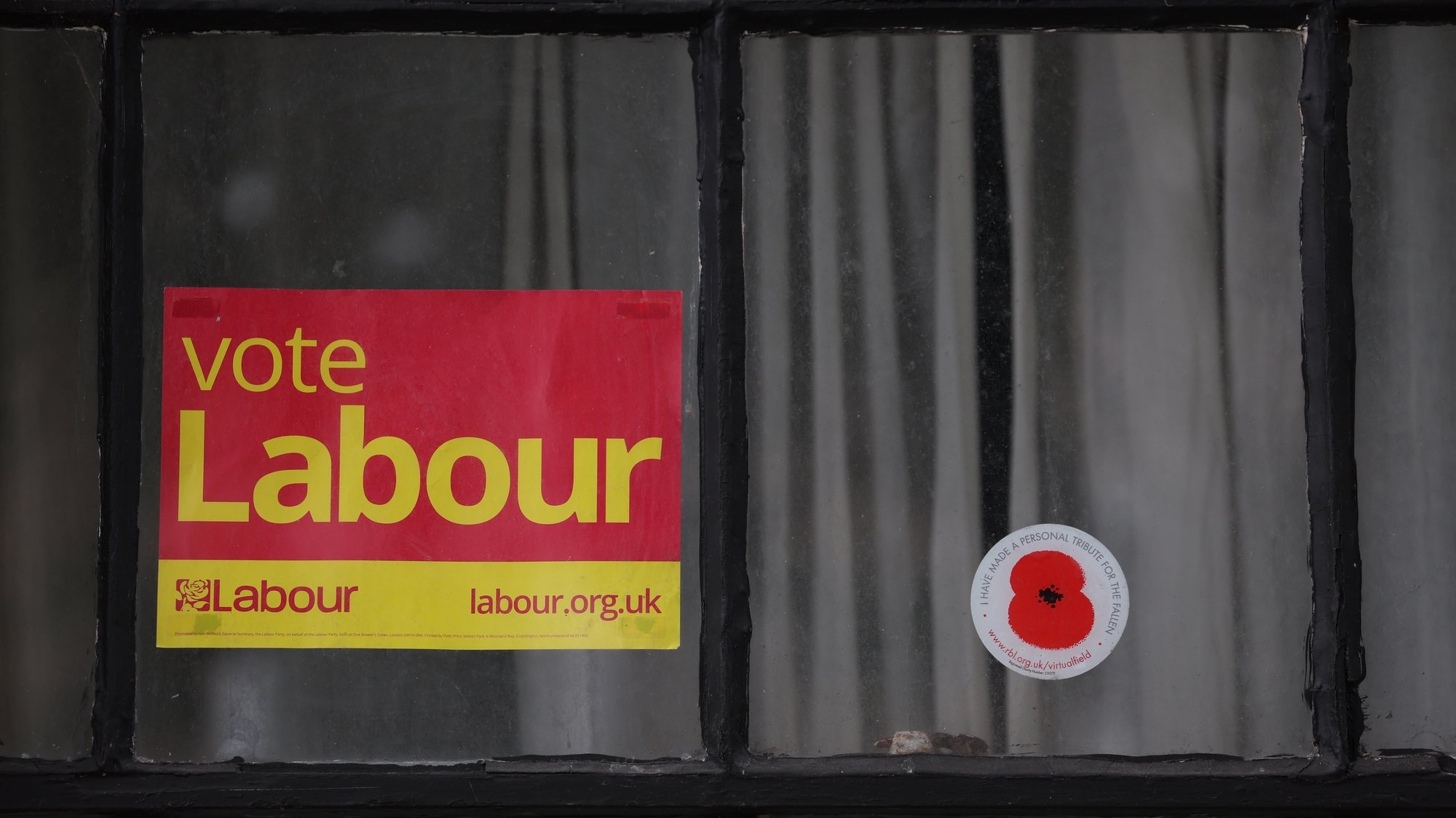 epa11439665 A Labour Party flyer in a house window in the Holborn &amp; St Pancras constituency in London, Britain, 26 June 2024. Holborn &amp; St Pancras is the constituency of Sir Keir Starmer leader of the Labour Party. On 04 July 2024 the UK goes to the polls to vote in a general election.  EPA/NEIL HALL