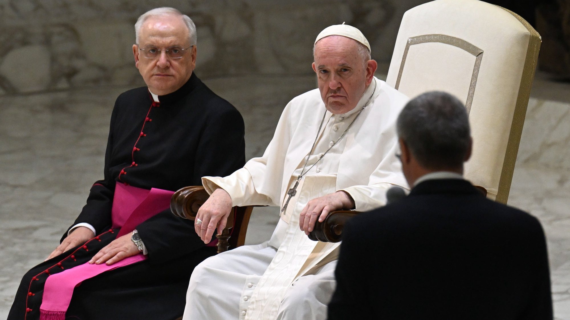 epa10179511 Pope Francis (C) sits next to Italian priest Monsignor Leonardo Sapienza (L) during an audience with members of the General Confederation of Italian Industry, commonly known as Confindustria, inside Nervi Hall at the Vatican, 12 September 2022.  EPA/CLAUDIO PERI