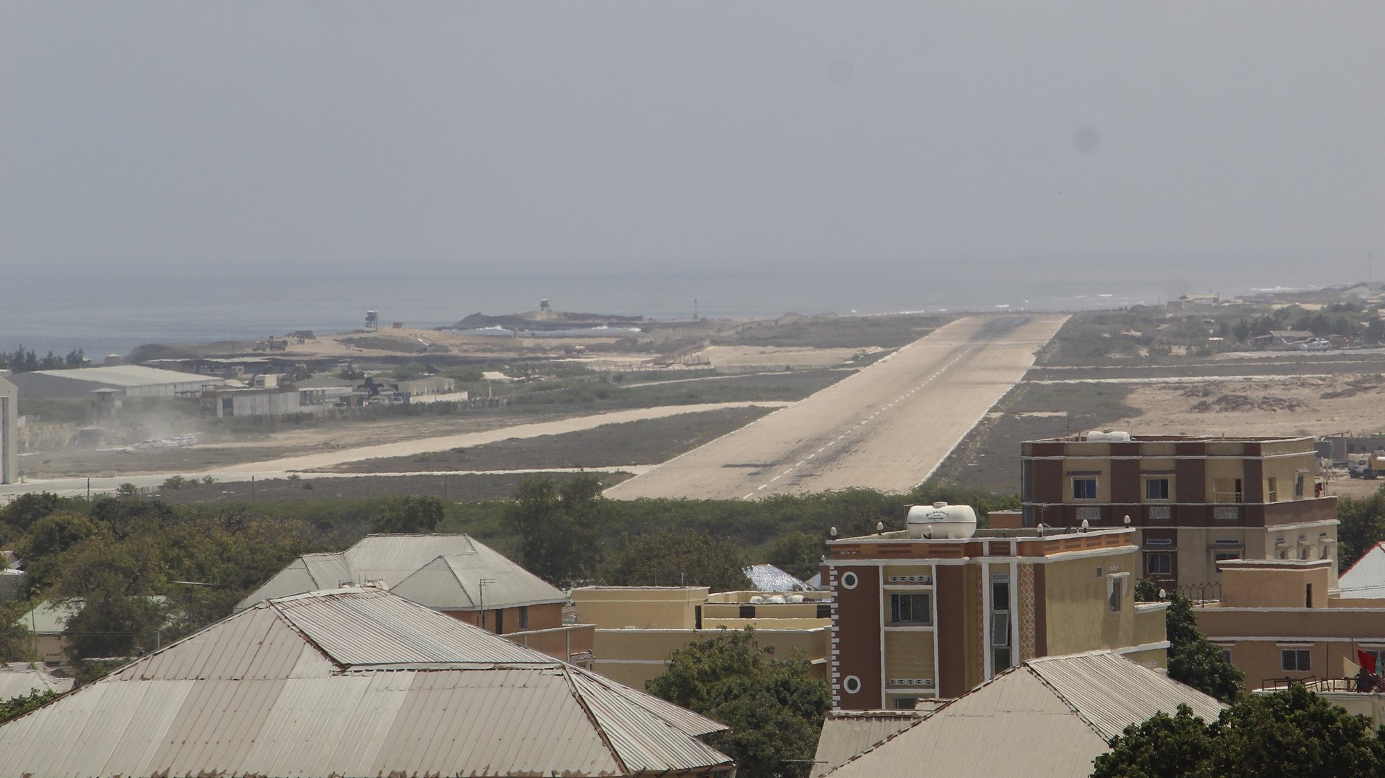 epa09843930 General view of Adan Abdulle International Airport in the aftermath of an attack by Al-Shabaab militants near its gate in Mogadishu, Somalia, 23 March 2022. According to Somali state television, security forces killed two militants attempting to burst into the Halane military base, located near the airport, hosting the African Union (AMISOM) peacekeeping forces, the United Nations personnel and other international organizations. Two AMISOM forces were reportedly injured.  EPA/SAID YUSUF WARSAME