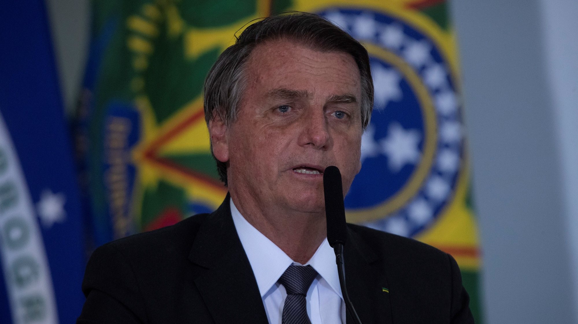 epa09343165 The President of Brazil, Jair Bolsonaro, speaks during the sanction ceremony of the Eletrobras Capitalization Law, at the Planalto Palace in Brasilia, Brazil, 13 July 2021. Bolsonaro sanctioned with some vetoes the Provisional Measure that regulates the privatization process of the state giant Eletrobras, the largest electricity company in Latin America, according to the Official Gazette of the Union published on 13 July.  EPA/Joedson Alves