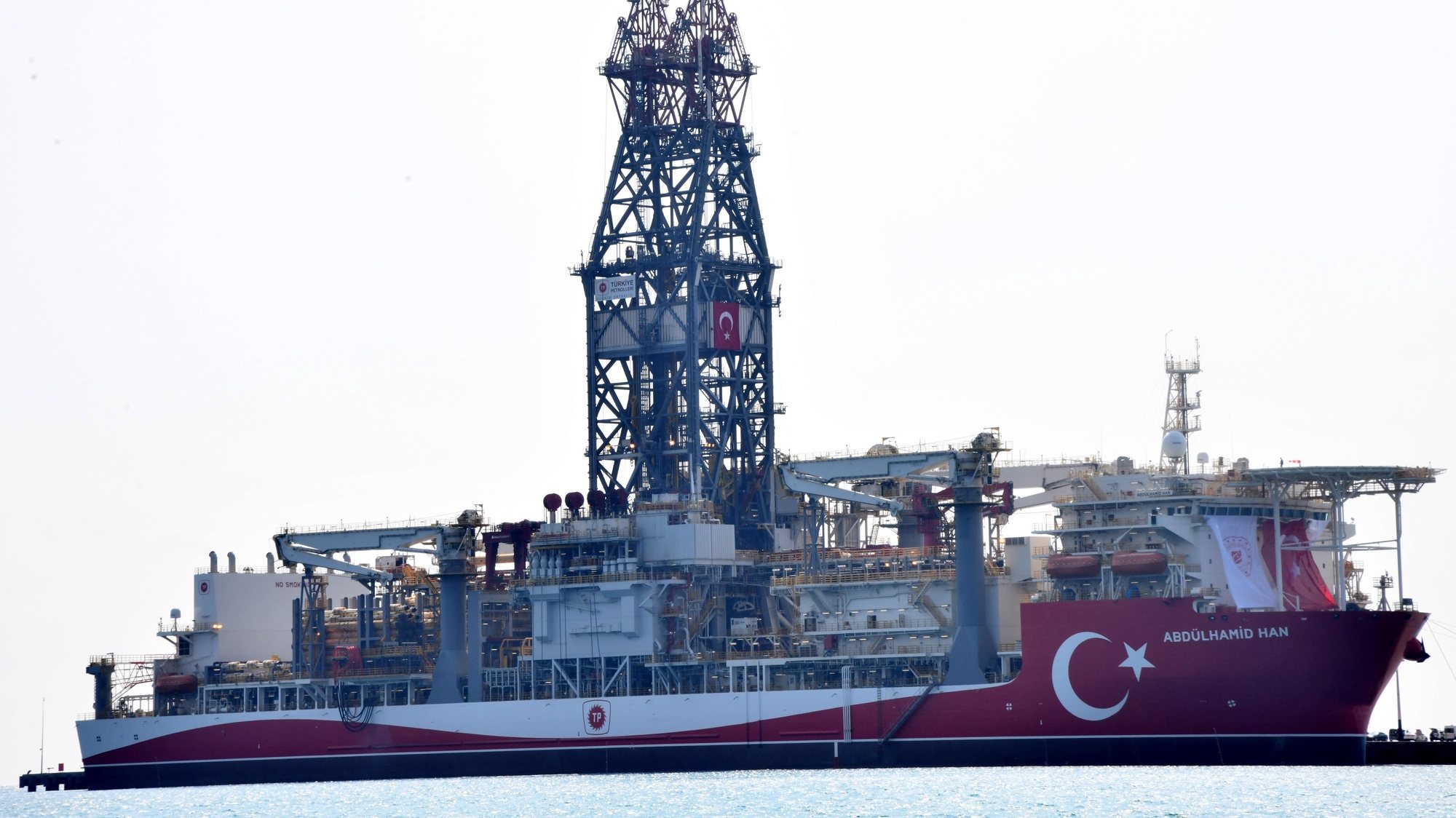 epa10112442 The Turkish drilling vessel Abdulhamid Han is seen at the Tasucu Port during a ceremony of first mission in Mersin, Turkey, 09 August 2022. Turkish forth drillship Abdulhamid Han is 238 meters (780 feet) long, 42 meters (137 ft) wide and 68,000 gross tons weighs also with a maximum drilling depth of 12,200 meters (40,026 ft). The ship will join a fleet of three ships for hydrocarbon exploration as a first mission at the Mediterranean.  EPA/STR