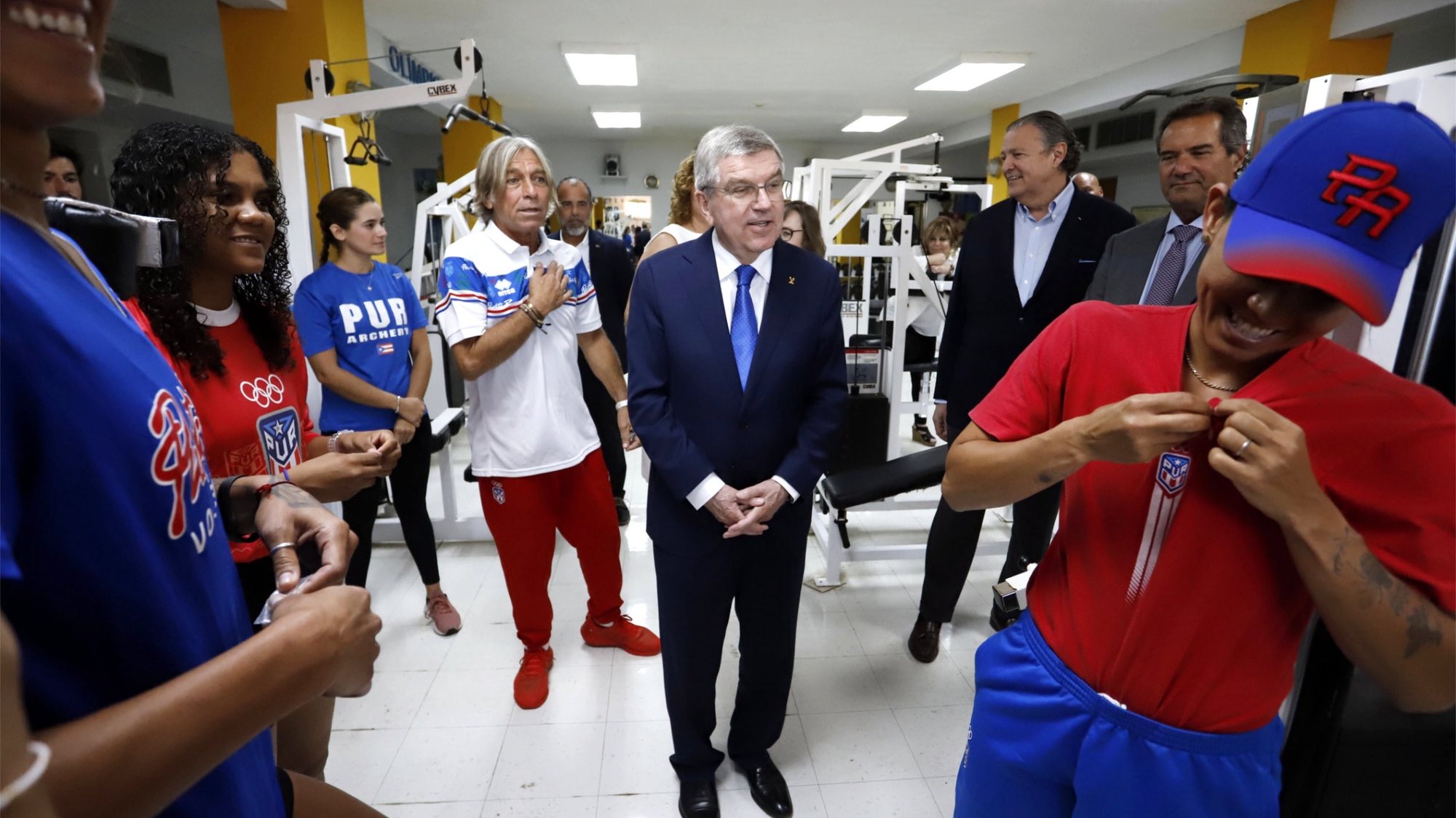 epa10508256 The president of the International Olympic Committee, Thomas Bach (C), greets athletes during a visit to the headquarters of the Puerto Rico Olympic Committee (Copur), in San Juan, Puerto Rico, 07 March 2023. The president of the International Olympic Committee, Thomas Bach, arrived in Puerto Rico on 07 March to meet with authorities and athletes and celebrate the 75th anniversary of the local Olympic Committee (Copur) on the island. Bach kicked off his Central American and Caribbean tour in Costa Rica, followed by Cuba, Jamaica and the Dominican Republic. After his two-day visit to Puerto Rico, he will travel to Barbados.  EPA/Thais Llorca