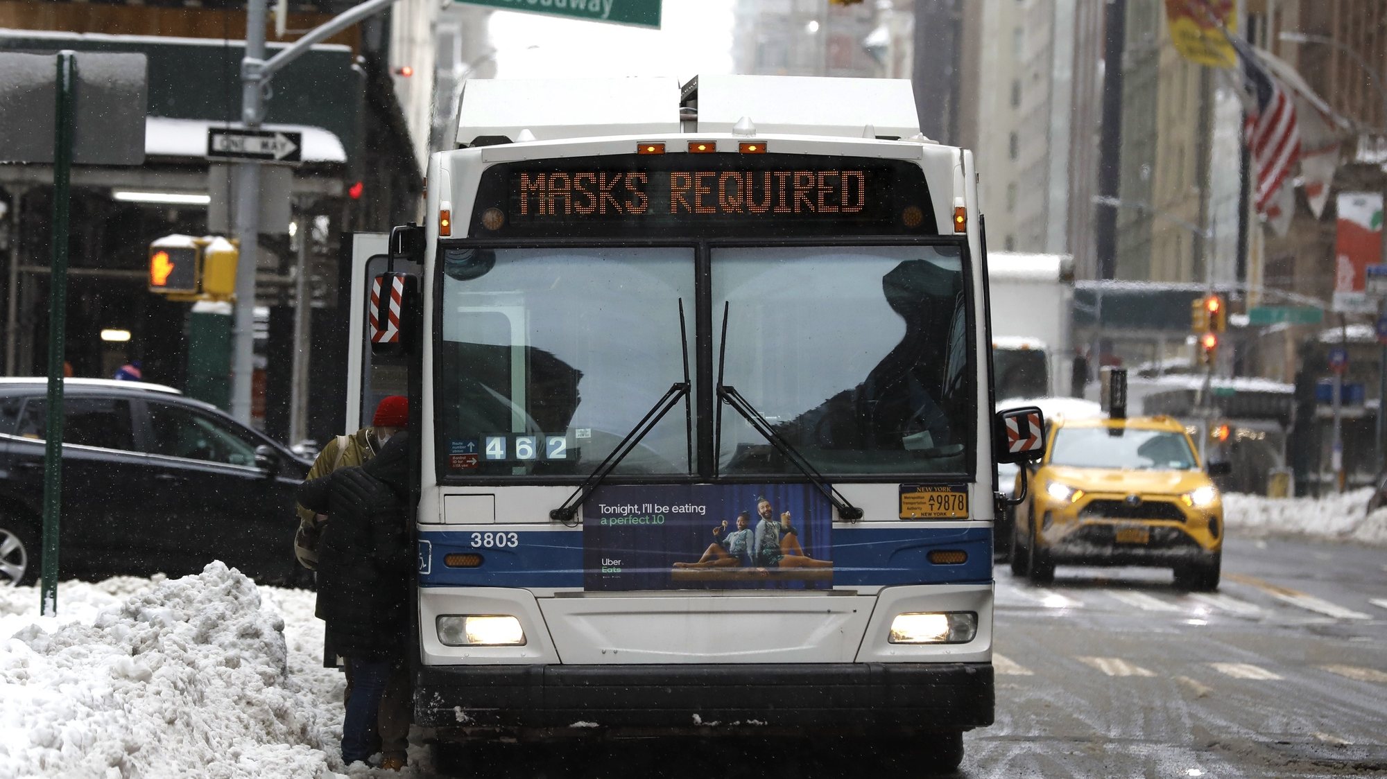 epaselect epa08982586 A New York City bus displays a sign requiring face masks at Columbus Circle in New York, New York, USA, 02 February 2021. The US Center for Disease Control has issued an order that requires face masks to be worn by all travelers while on public transportation (which includes all passengers and all personnel operating conveyances). People must wear masks that completely cover both the mouth and nose while awaiting, boarding, disembarking, or traveling on airplanes, ships, ferries, trains, subways, buses, taxis, and ride-shares as they are traveling into, within, or out of the United States and U.S. territories.  EPA/Peter Foley