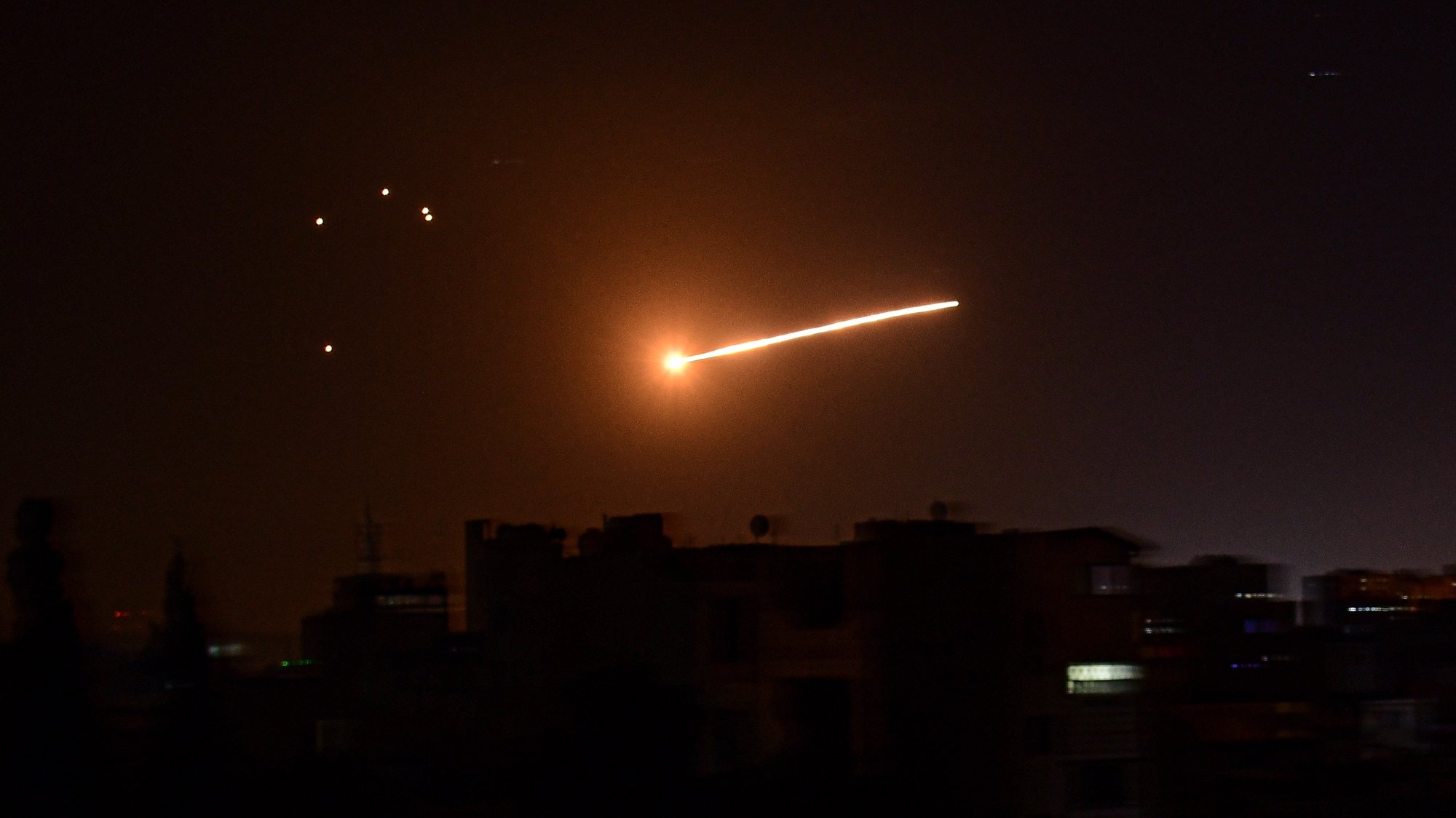 epa08243652 A handout photo made available by the official Syrian Arab News Agency (SANA) shows Syrian air defense intercepting missiles over Damascus, Syria, late 23 February 2020. According to SANA, the Syrian air defenses intercepted missiles fired by Israel from the occupied Syrian Golan heights. An Israeli army spokesman said six operatives were killed in Israeli strikes against Palestinian Islamic Jihad targets in Syria in response to rockets fired from Gaza toward Israel.  EPA/SANA HANDOUT  HANDOUT EDITORIAL USE ONLY/NO SALES