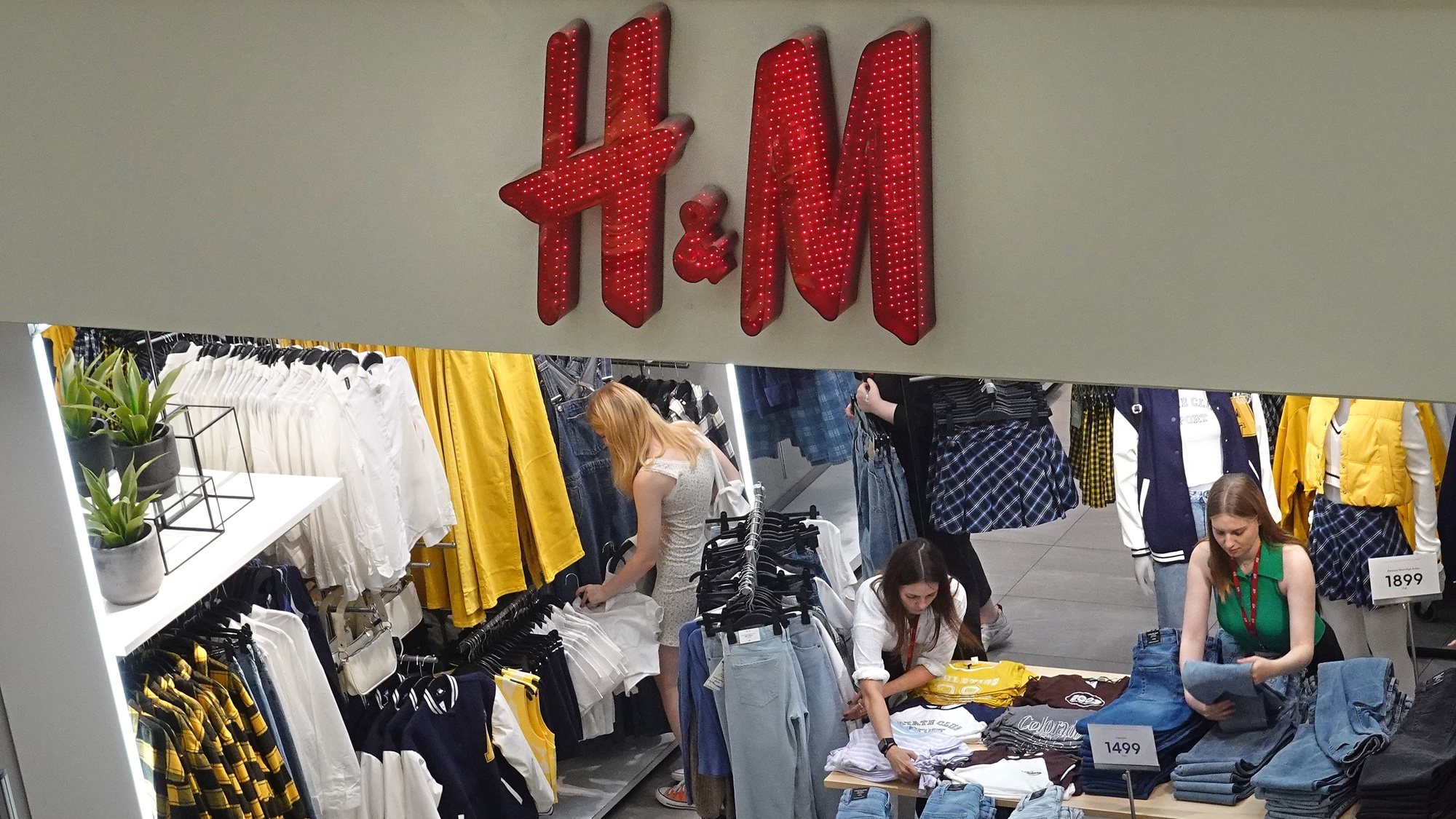 epa10104115 A logo of H&amp;M Group (Hennes &amp; Mauritz AB) multinational clothing company is seen on a store in the Metropolis shopping mall in Moscow, Russia, 03 August 2022. H&amp;M Group (H &amp; M Hennes &amp; Mauritz AB) multinational clothing company announced in July 2022 of its decision to wind down its business in Russia due to &#039;current operational challenges and an unpredictable future&#039;. As part of this process the company reopens its physical stores for selling remaining stock in Russia. Earlier, in March 2022 the company paused all sales in Russia, being among some other brands which announced the suspension or limitation of their business in Russia as the result of sanctions imposed by the West on Russia in response to what the Russian President declared as a &#039;Special Military Operation&#039; in Ukraine. Russian troops entered Ukraine on 24 February 2022, prompting a series of severe economic sanctions imposed by Western countries on Russia.  EPA/MAXIM SHIPENKOV
