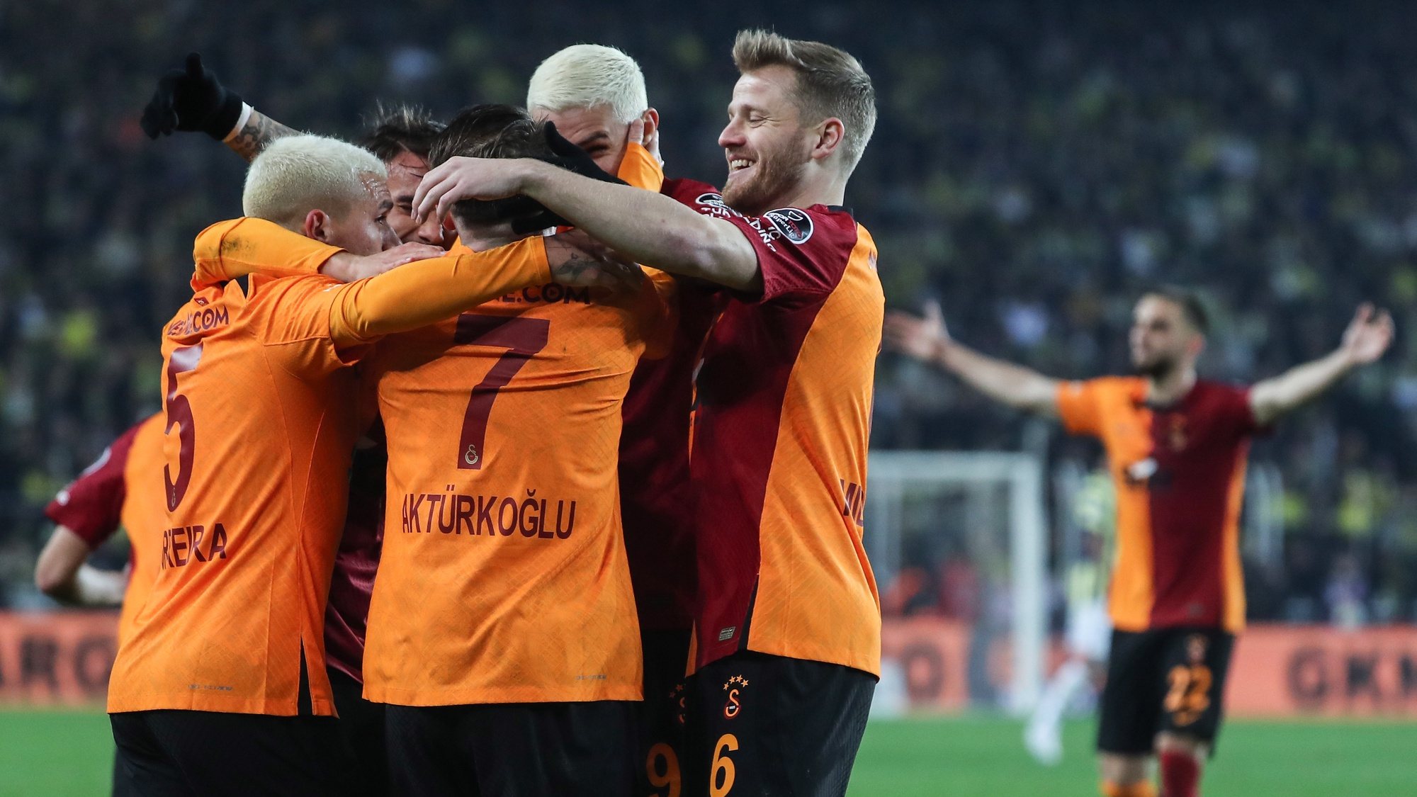epa10396142 Players of Galatasaray celebrate after scoring the 2-0 lead during the Turkish Super League soccer derby match between Fenerbahce and Galatasaray in Istanbul, Turkey, 08 January 2023.  EPA/ERDEM SAHIN