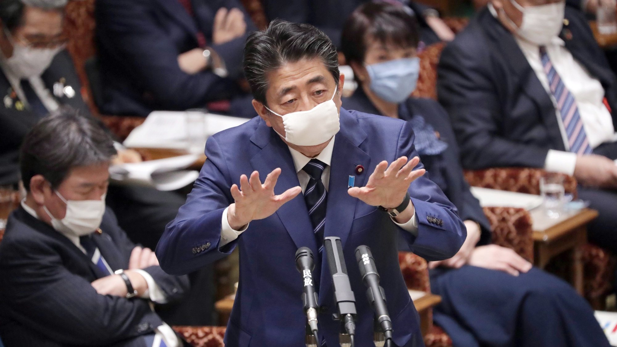 epa08335999 Wearing a mask, Japanese Prime Minister Shinzo Abe speaks during an Upper House Accounts Committee meeting in Tokyo, Japan, 01 April 2020. According to reports, on 31 March, Tokyo has a total number of cases exceeding 500. Calls are rising for Prime Minister Shinzo Abe to declare state of emergency.  EPA/JIJI PRESS JAPAN OUT  EDITORIAL USE ONLY/NO SALES/NO ARCHIVES
