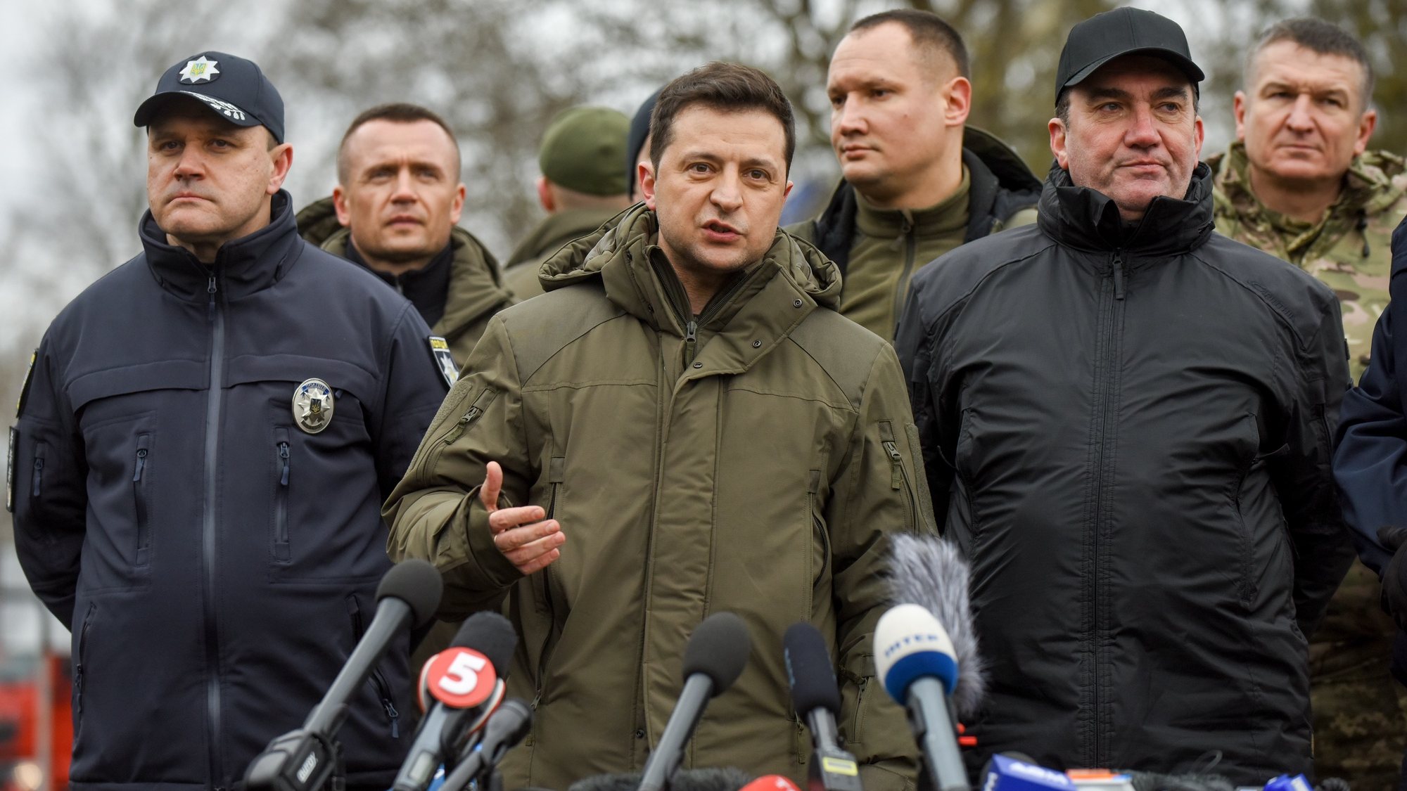 epa09750316 Ukrainian President Volodymyr Zelensky (C) attends an exercises near the Kalanchak village of Skadovsk district of Kherson area, South Ukraine, 12 February 2022 amid escalation on the Ukraine-Russian border. The special tactical training exercises for timely and effective response to situation with destabilizing factors were conducted in Kherson region, which are located critically close to the administrative border with Crimea peninsula annexed by Russia in 2014. More than thousand law enforcement officers (police, National Guard, State Emergency Service, Border Guard service, State migration Service and so on) special equipment, including a helicopter group were involved in the exercises.  EPA/OLEG PETRASYUK