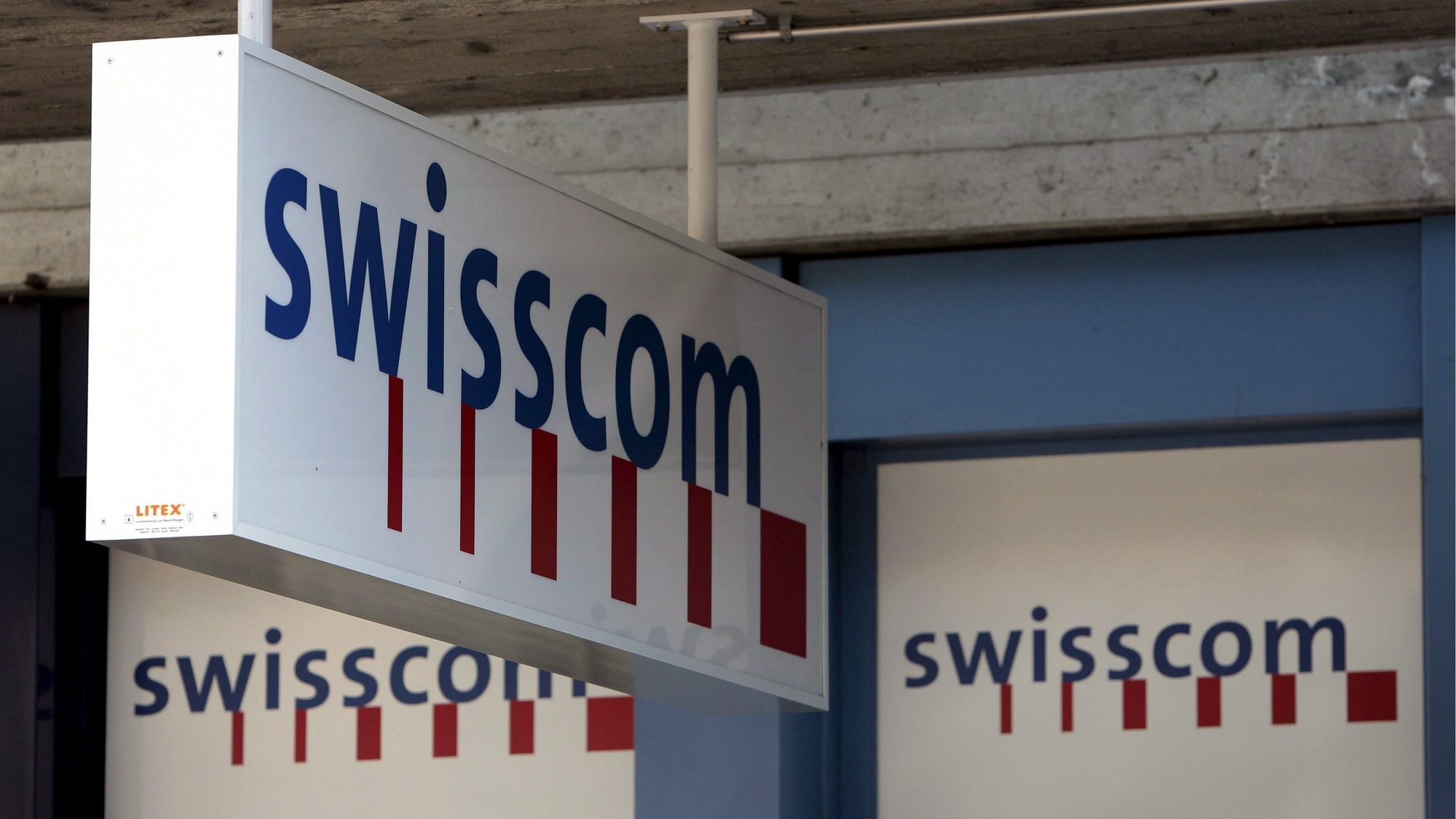 epa00954117 (FILES) Picture dated 16 February 2007 shows Swisscom logos at the company&#039;s branch in Buchs, Switzerland. Swisscom AG, Switzerland&#039;s largest telephone company, announced Monday, 12 March 2007, that it will offer to buy Italy&#039;s FastWeb SpA for 3.7 billion euros in cash to add a million broadband Internet customers. Swisscom offered 47 euros for each FastWeb share, or 12 percent more than the closing price of 42.02 euros on March 09. Swisscom plans to finance the purchase with debt and a sale of as many as 4.9 million company shares.  EPA/EDDY RISCH