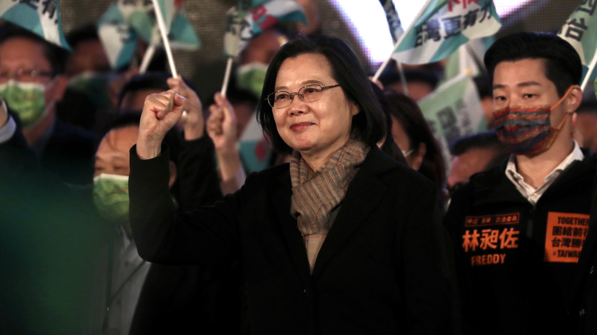 epa09646938 Taiwan President Tsai Ing-wen (C) gestures in front of Democratic Progressive Party (DPP) supporters, during a rally on the eve of Taiwan’s referendum in Taipei, Taiwan, 17 December 2021. The referendum will have a major impact with the country&#039;s energy policies, pork import and national policies.  EPA/RITCHIE B. TONGO