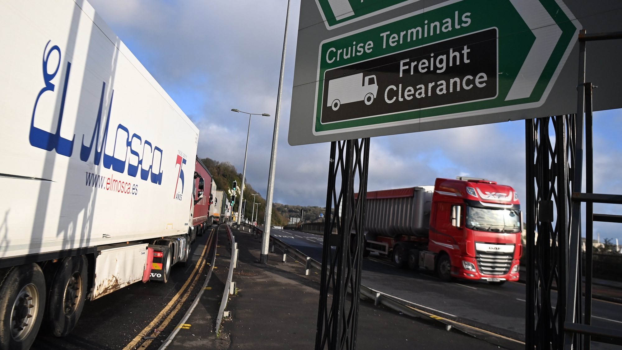 epa08902595 Haulage drivers stuck in a queue outside the Port of Dover in Dover, Britain, 24 December 2020. Dover Port has reopened its border after France closed its border with Britain for 48 hours over concerns about the new coronavirus variant. Lorry drivers must now obtain negative coronavirus tests before they will be allowed to cross by sea and the Port of Dover remains closed to outbound traffic on the morning of 23 December 2020.  EPA/ANDY RAIN