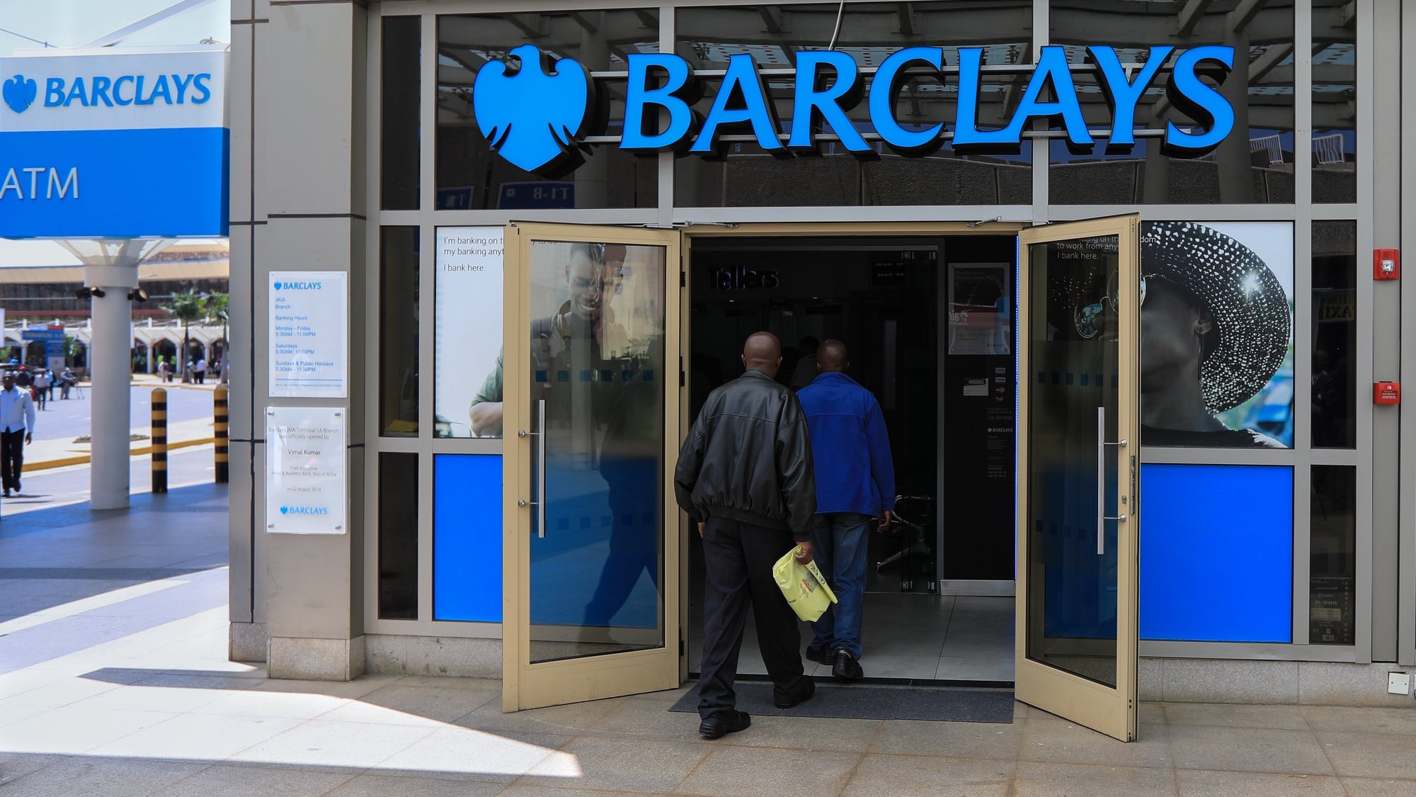 epa09017707 (FILE) - People enter into a Barclays bank branch located at the entrance of one of the international arrivals terminals at the Jomo Kenyatta International Airport (JKIA) in Nairobi, Kenya, 06 March 2019 (reissued 17 February 2021). Barclays is due to release its full year 2020 results on 17 February 2021.  EPA/DANIEL IRUNGU *** Local Caption *** 55871938