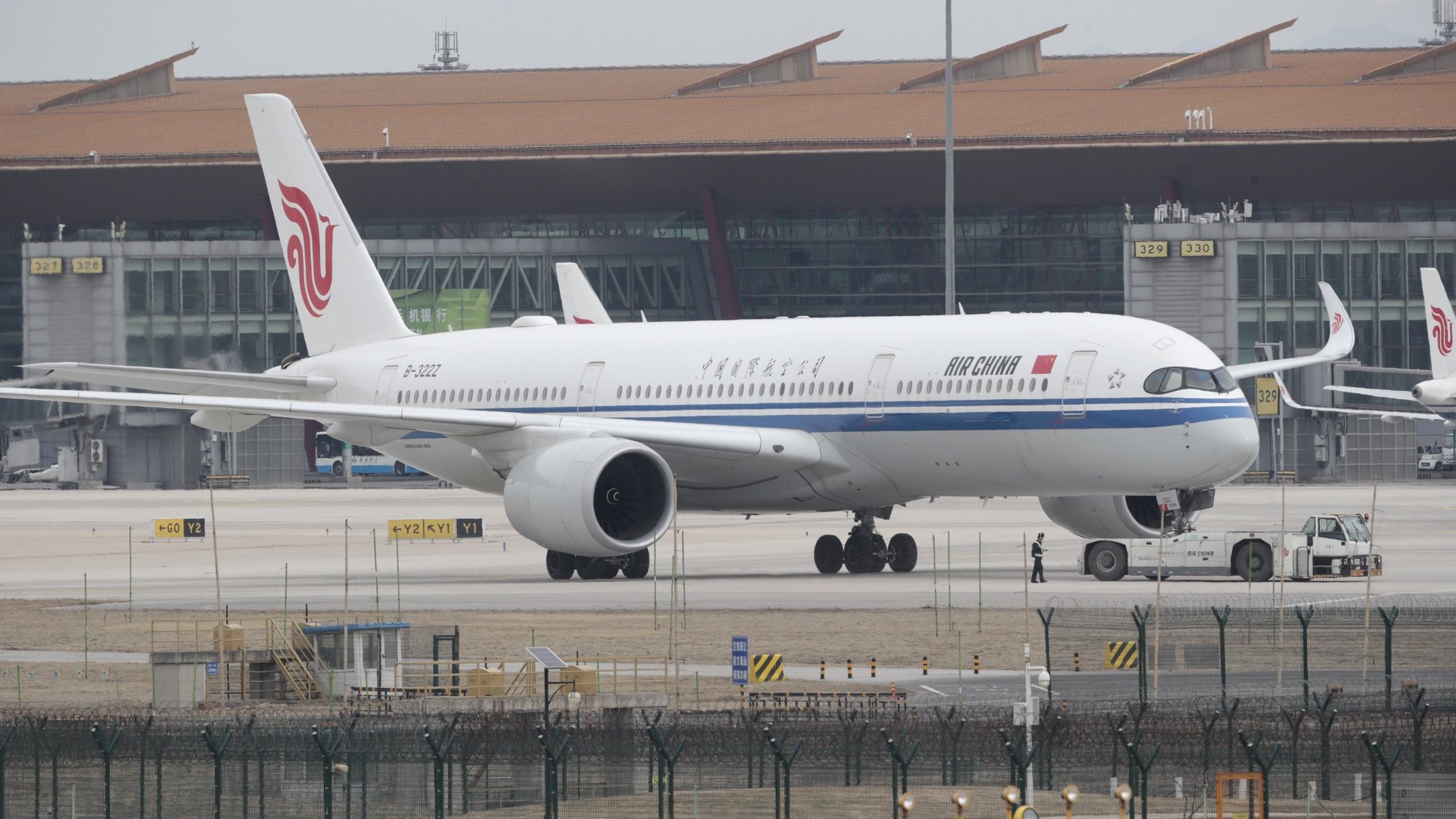 epa09841613 An airplane of Air China is seen at Beijing Capital International Airport in Beijing, China, 22 March 2022. A China Eastern Airlines Boeing 737-800 with 132 people on board crashed in southern China on a flight from Kunming to Guangzhou on 21 March 2022, according to China&#039;s Civil Aviation Administration.  EPA/WU HONG