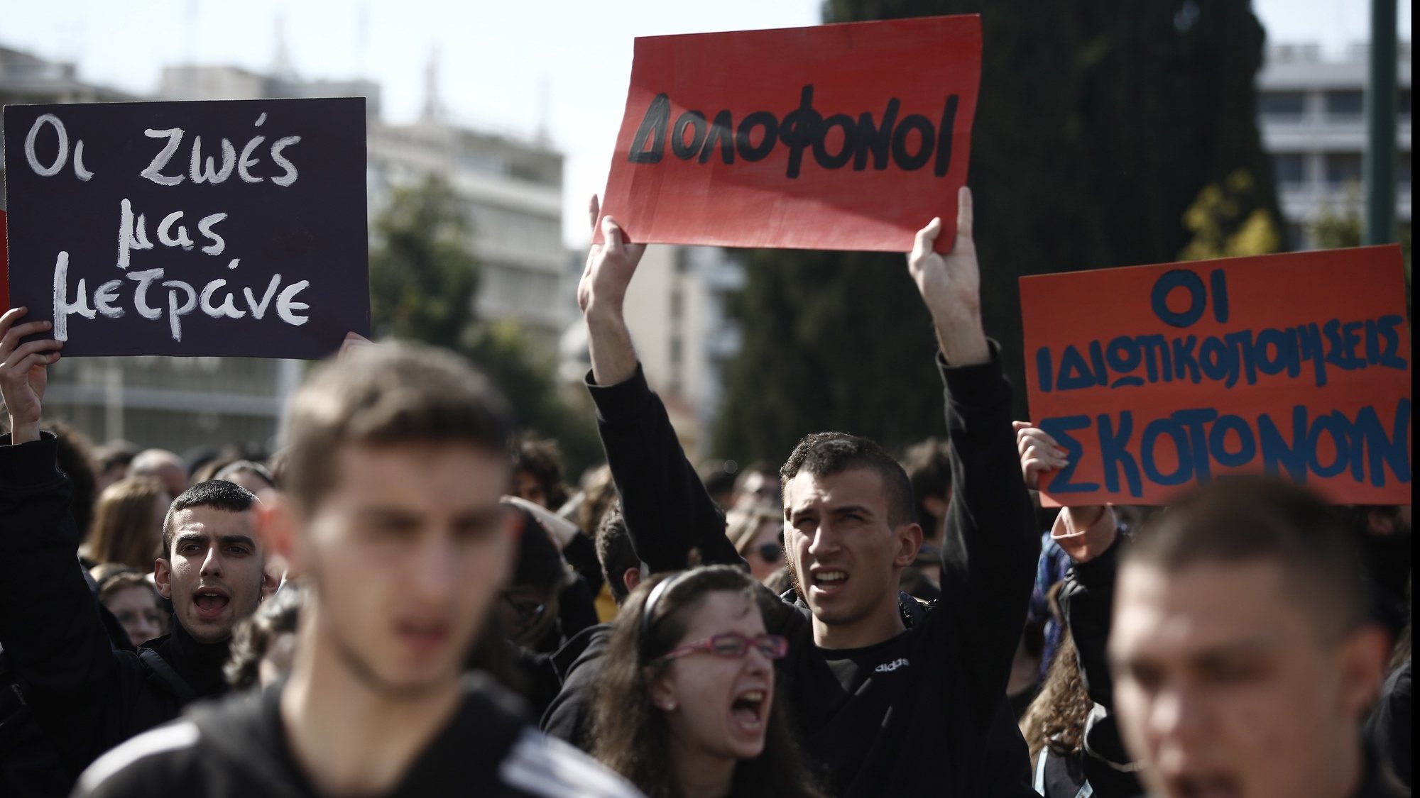epa10511544 Students hold placards during a protest following a deadly train crash, in Athens, Greece 09 March 2023. A head-on crash between two trains along the Athens-Thessaloniki line on the night of 28 February claimed the lives of 57 people.  EPA/YANNIS KOLESIDIS