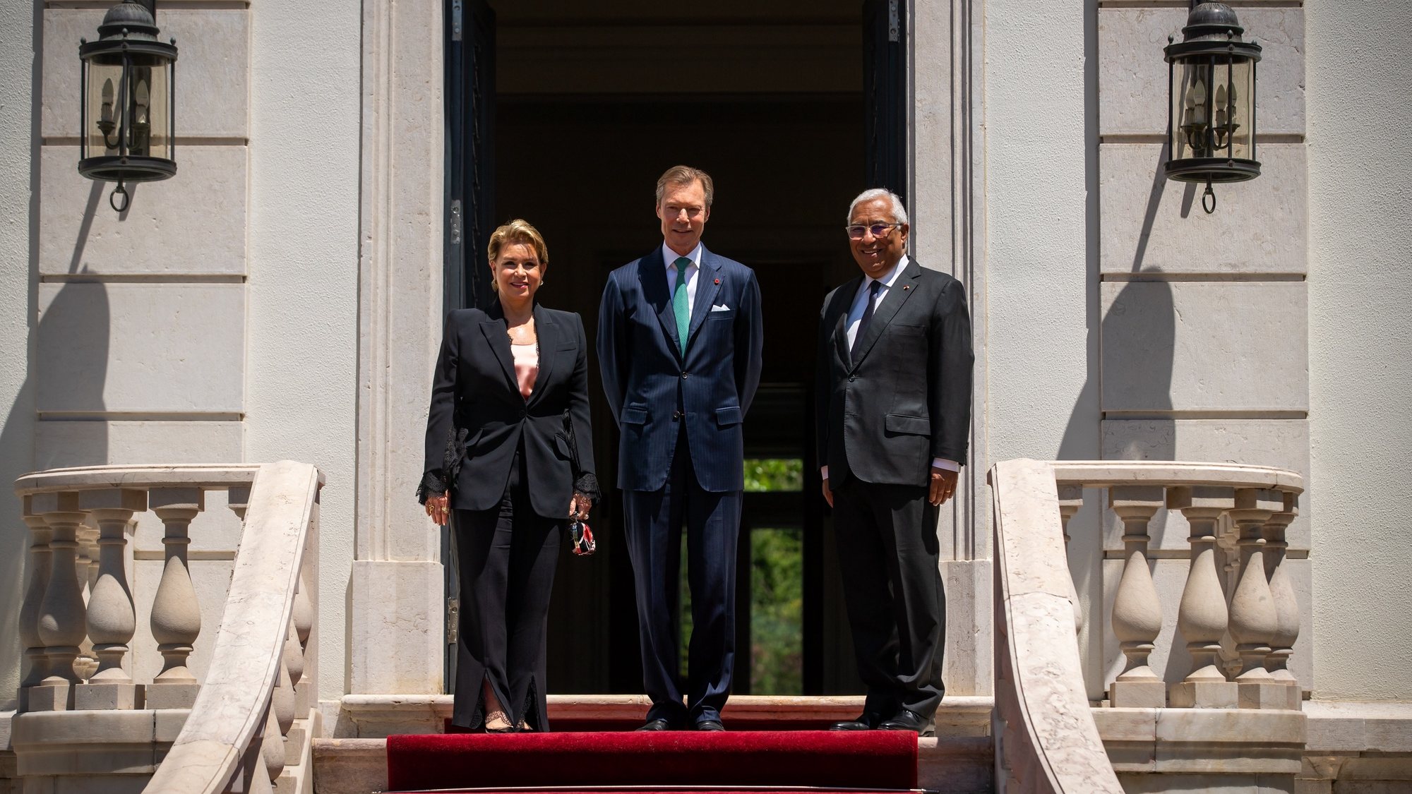 epa09942263 The Grand Duke Henri of Luxembourg (C) and his wife Grand Duchess Maria Teresa of Luxembourg (L), pose for a photograph with the Portuguese Prime Minister, Antonio Costa (R), on arrival at Sao Bento Palace on the second day of a two day official visit to Portugal, in Lisbon, 12 May 2022.  EPA/JOSE SENA GOULAO