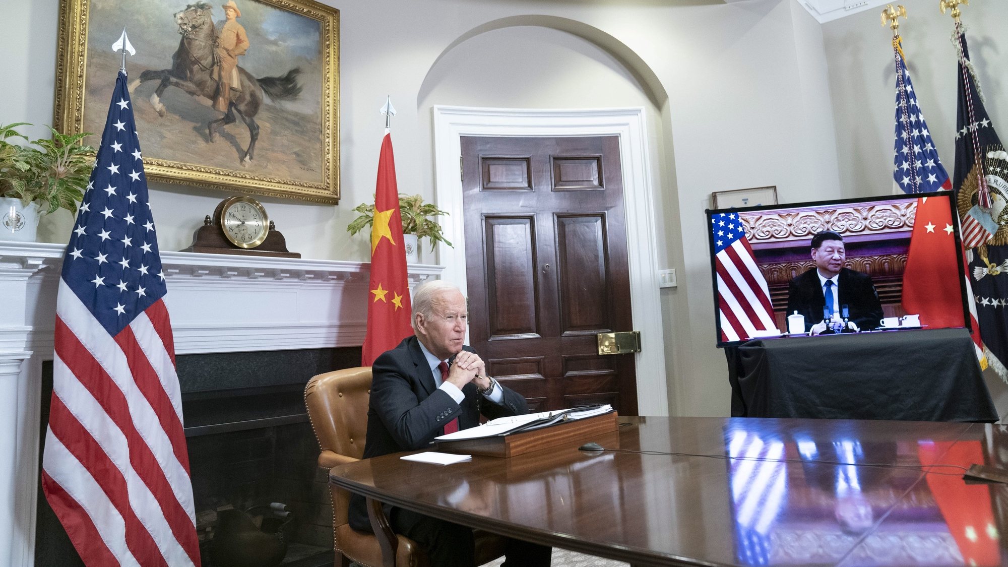 epa09584543 US President Joe Biden listens during a virtual summit with Chinese President Xi Jinping in the Roosevelt Room of the White House in Washington DC, USA, 15 November 2021.  EPA/SARAH SILBIGER / POOL