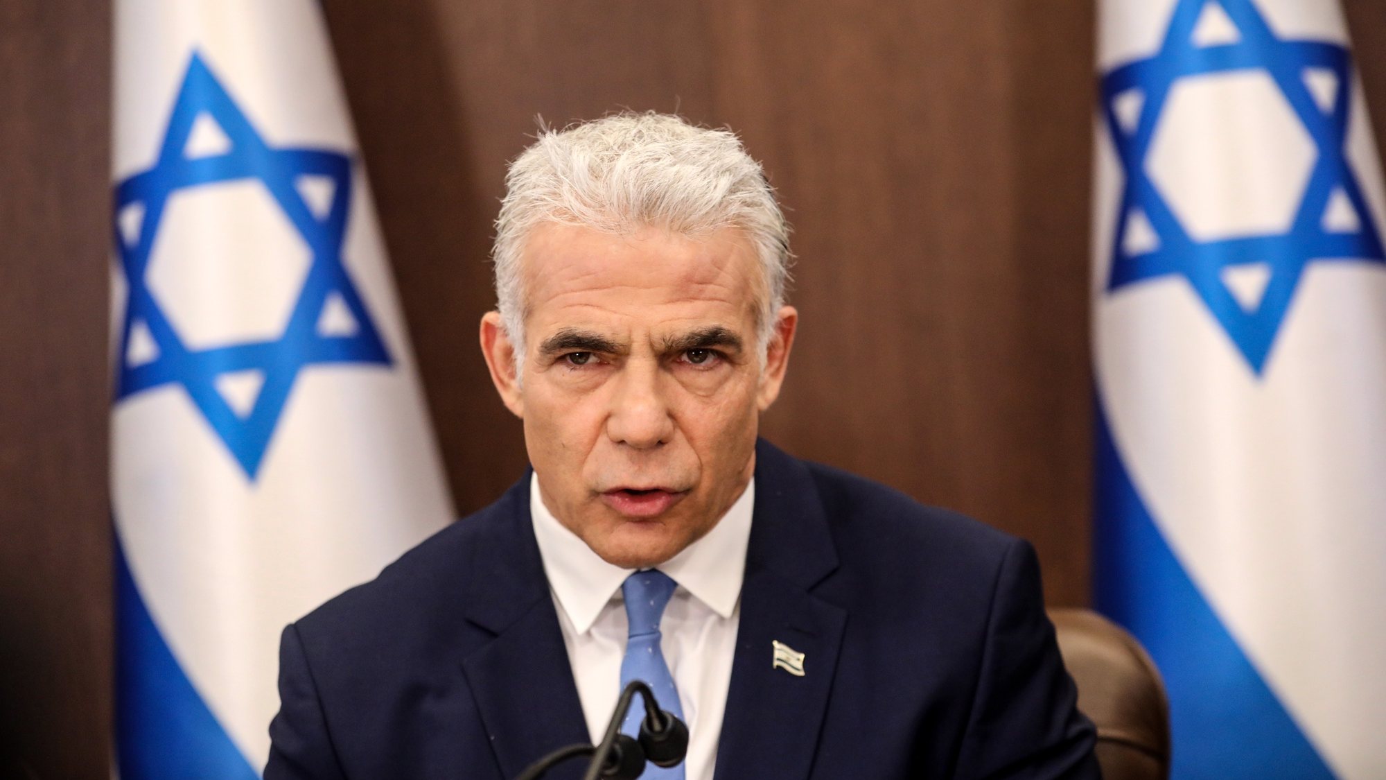 epa10099635 Israel&#039;s caretaker Prime Minister Yair Lapid heads the weekly cabinet meeting in Jerusalem, on July 31, 2022.  EPA/GIL COHEN-MAGEN / POOL