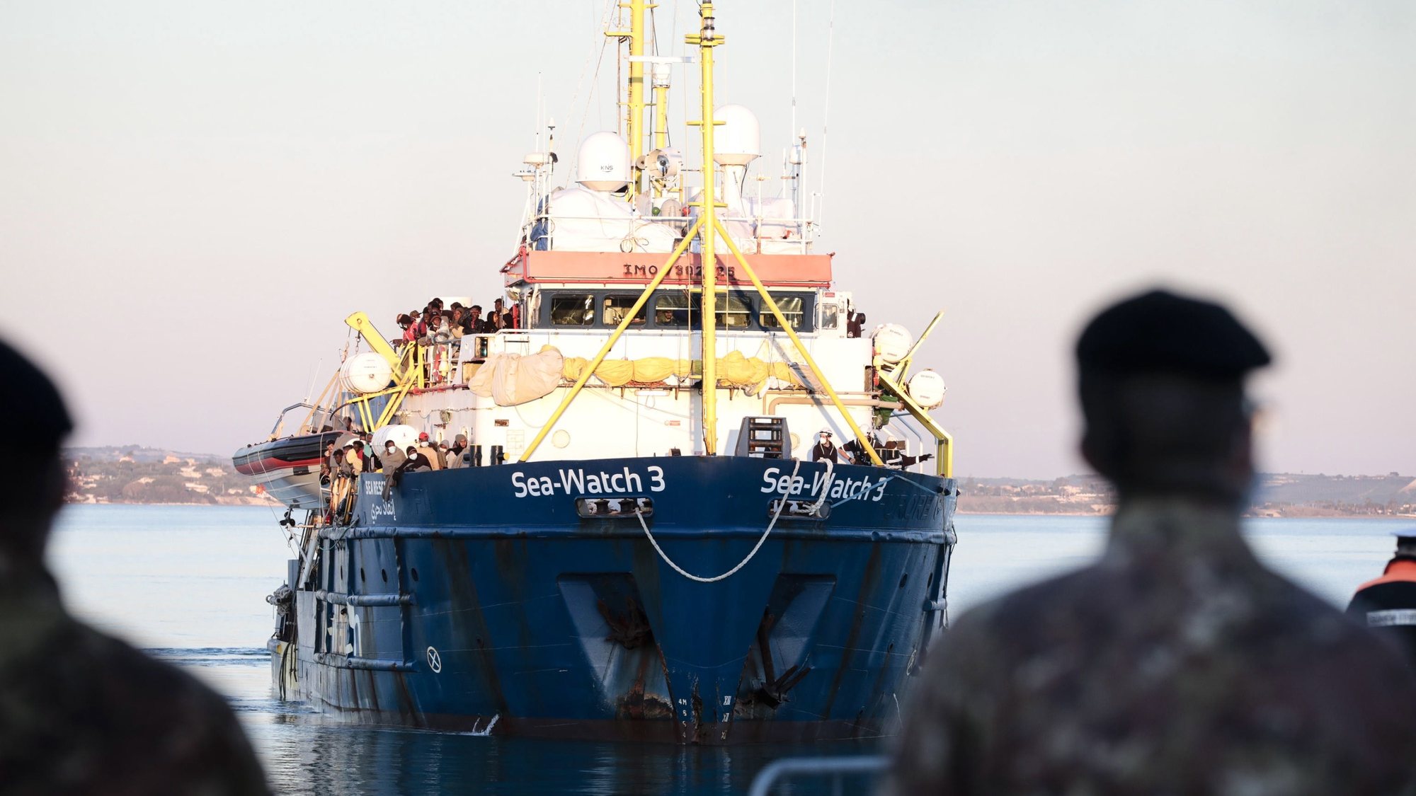 epa09661649 The German NGO migrant rescue ship Sea Watch 3 with 440 migrants on board arrives in the port of Pozzallo, Sicily island, southern Italy, 31 December 2021. The German NGO migrant rescue ship Sea Watch 3 was assigned the port of Pozzallo in Sicily to land its 440 rescued migrants after a week at sea. The ship was at sea since Christmas Eve after carrying out five rescues.  EPA/FRANCESCO RUTA