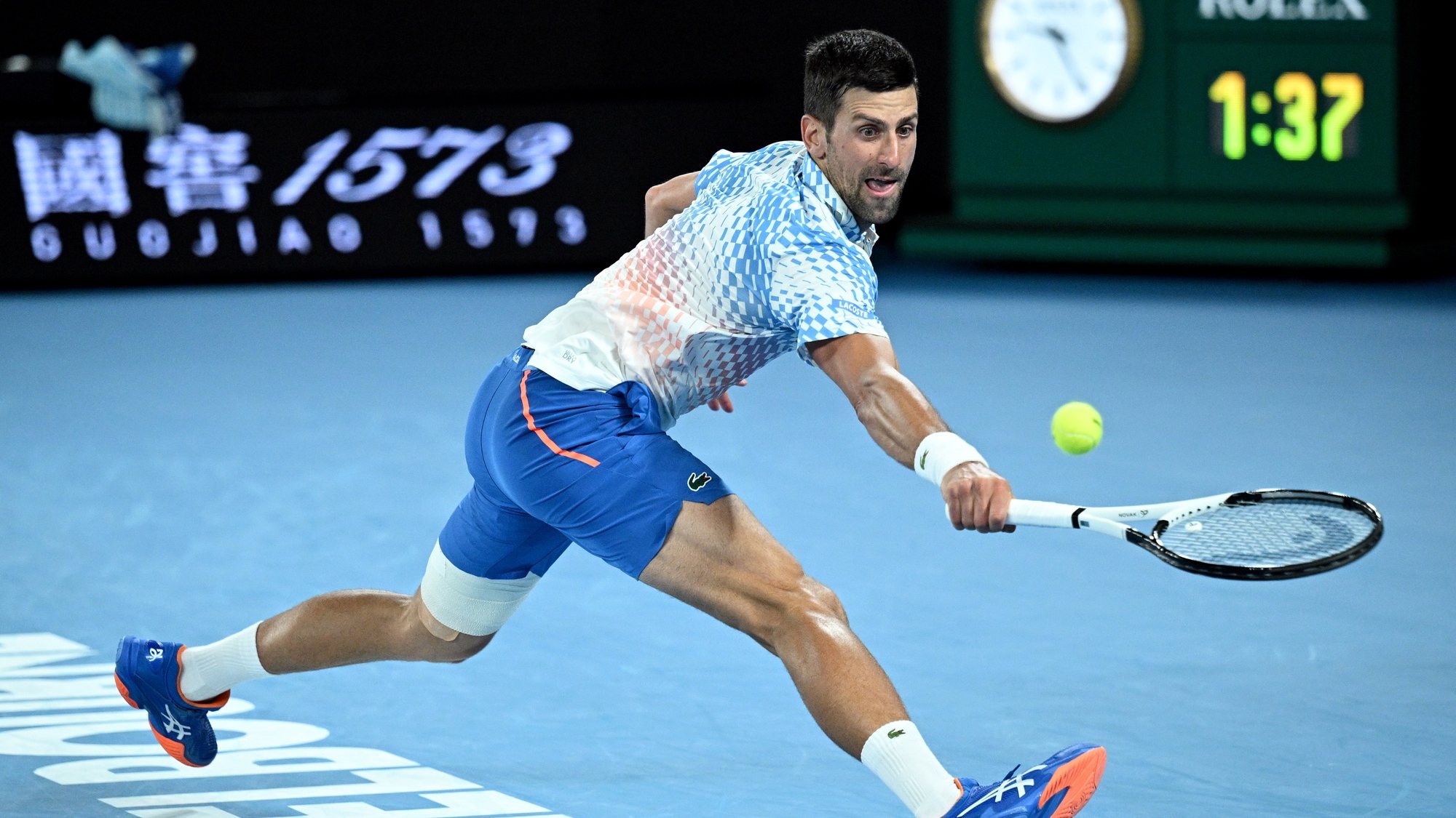 epa10428268 Novak Djokovic of Serbia in action during his quarterfinal match against Andrey Rublev  of Russia at the 2023 Australian Open tennis tournament in Melbourne, Australia, 25 January 2023.  EPA/JAMES ROSS AUSTRALIA AND NEW ZEALAND OUT