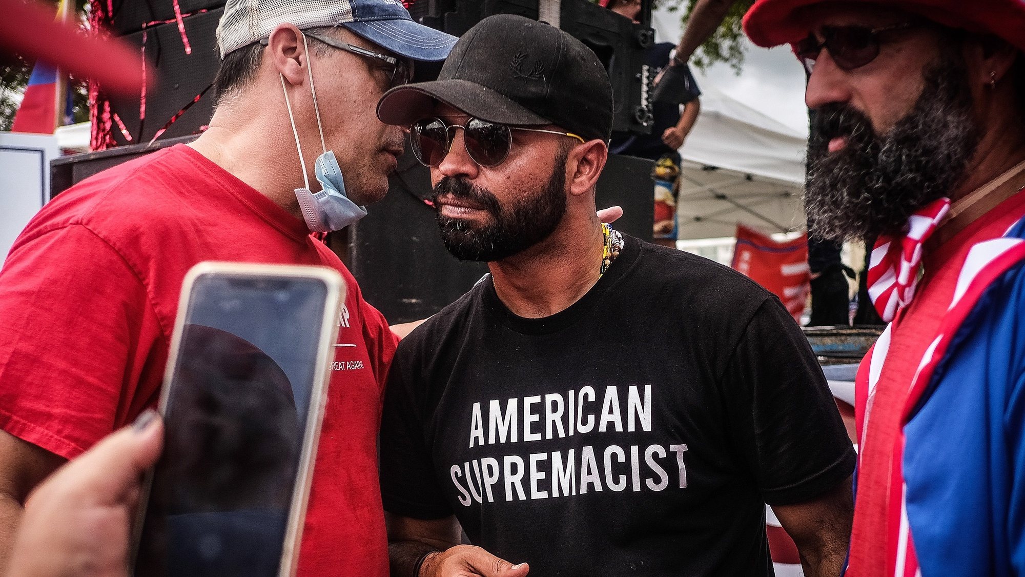 epa08985258 (FILE) - Far-right group the Proud Boys leader Enrique Tarrio (R) interacts with supporters during the &#039;Latinos for Trump&#039; demonstration, at Tamiami Park in Miami, Florida, USA, 18 October 2020 (reissued 03 February 2021). Canada has labbeled the Far-right group the Proud Boys a terrorist group, Canadian public safety minister Bill Blair announced on 03 February 2021.  EPA/MARIO CRUZ