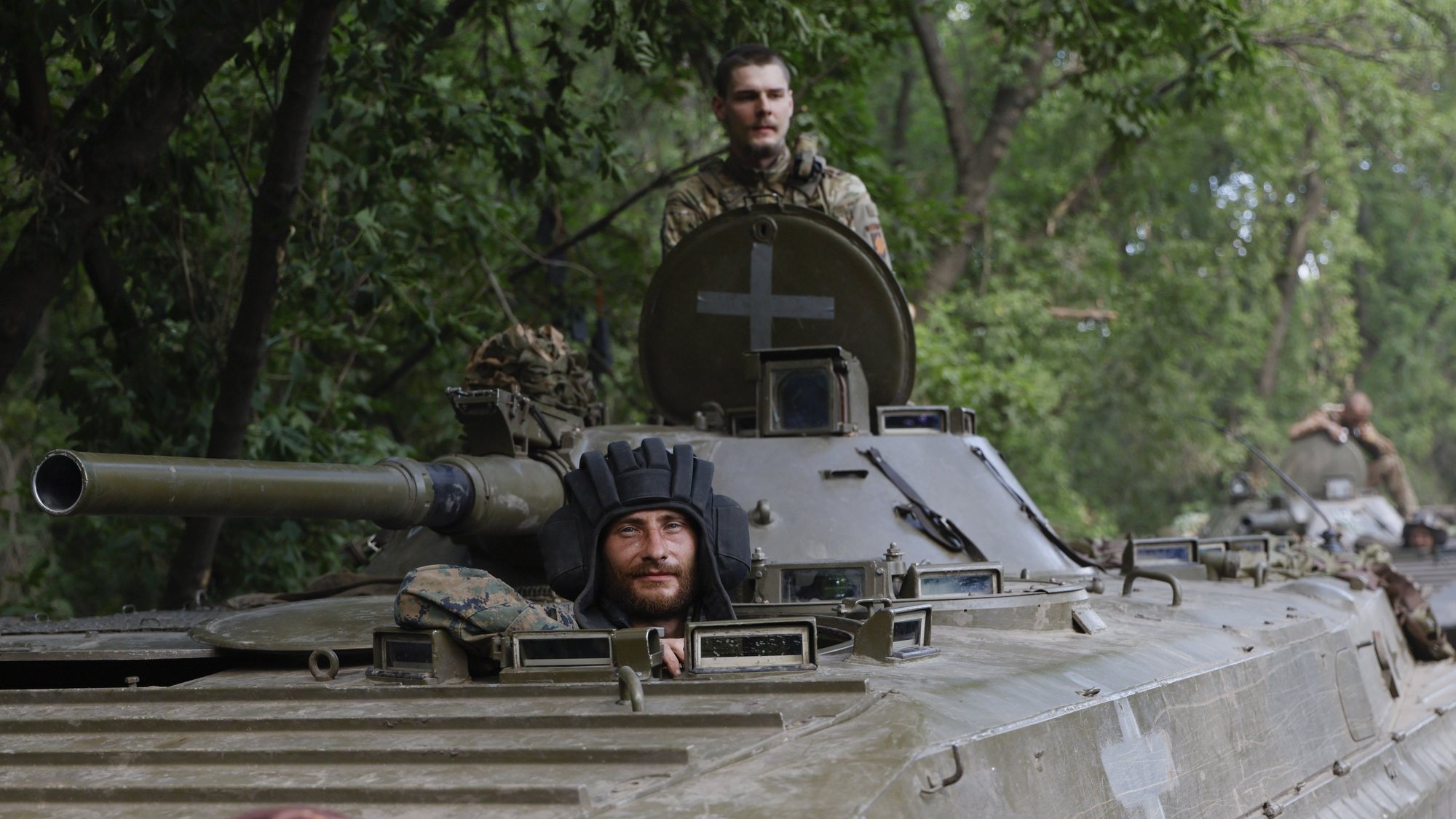 epa10722097 Ukrainian servicemen from the 3rd Separate Assault Brigade ride an armoured personnel carrier (APC) at a road near the frontline city of Bakhmut, Donetsk region, eastern Ukraine, 01 July 2023 (issued 02 July 2023), amid the Russian invasion. The frontline city of Bakhmut, a key target for Russian forces, has seen heavy fighting for months. Russian troops entered Ukrainian territory in February 2022, starting a conflict that has provoked destruction and a humanitarian crisis.  EPA/ALEX BABENKO