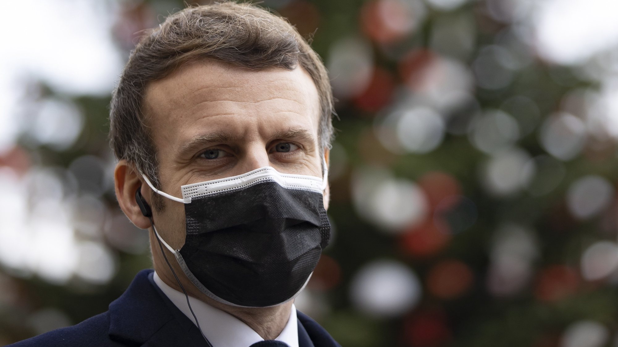 epa08889601 French President Emmanuel Macron seen at the Elysee Palace in Paris, France, 16 December 2020 (issued 17 December 2020). According to a statement by the Elysee Palace on 17 December 2020, French President was tested positive for coronavirus Covid-19. Macron will stay in isolation but will continue to perform his duties.  EPA/IAN LANGSDON
