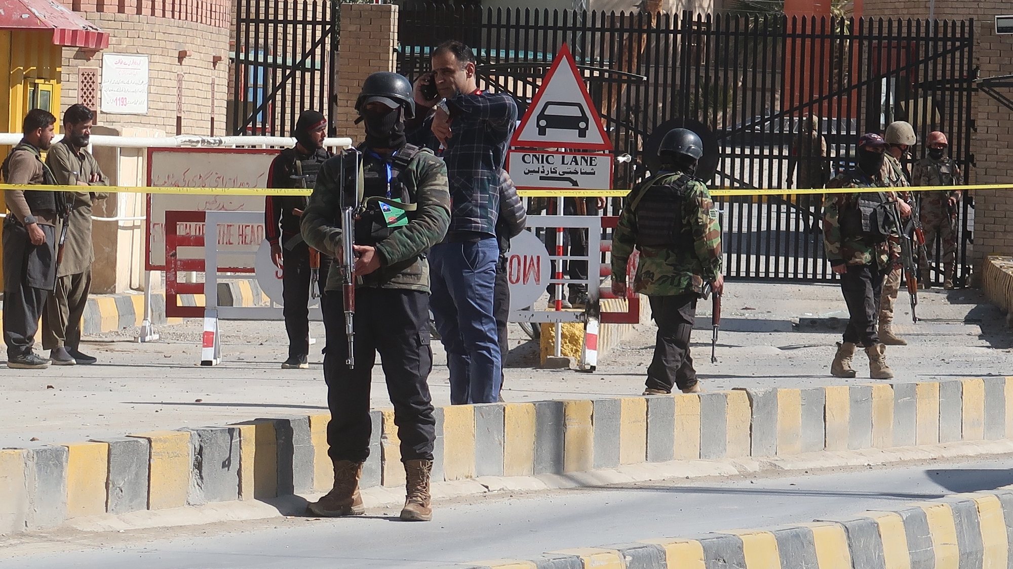 epa10448555 Pakistani security officials inspect the scene of a blast in Quetta, the provincial capital of Baluchistan, Pakistan, 05 February 2023. At least five people were injured in an explosion near the Quetta Police Lines area, police said.  EPA/FAYYAZ AHMAD