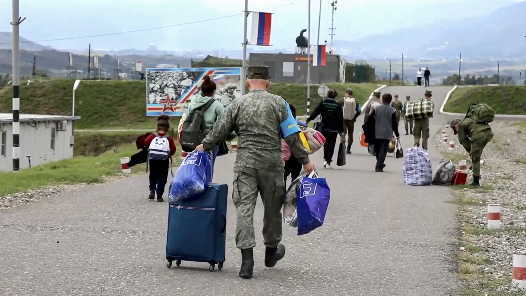 epa10874835 A still image taken from a handout video provided by the Russian Defence Ministry press-service shows civilians at the Russian peacekeepers&#039; camp near Stepanakert, Nagorno-Karabakh, 21 September 2023. About 5,000 people have been brought to the location of the Russian peacekeeping contingent as Russian peacekeepers have evacuated civilians from Martakert, Martuni, and Askeran districts of Nagorno-Karabakh, the Russian Defence Ministry announced on 21 September. Azerbaijan government&#039;s announced that a ceasefire was agreed with Armenian separatists in Nagorno-Karabakh on 20 September, after a 24-hour military offensive to take control of the enclave.  EPA/RUSSIAN DEFENCE MINISTRY PRESS SERVICE HANDOUT MANDATORY CREDIT -- BEST QUALITY AVAILABLE HANDOUT EDITORIAL USE ONLY/NO SALES