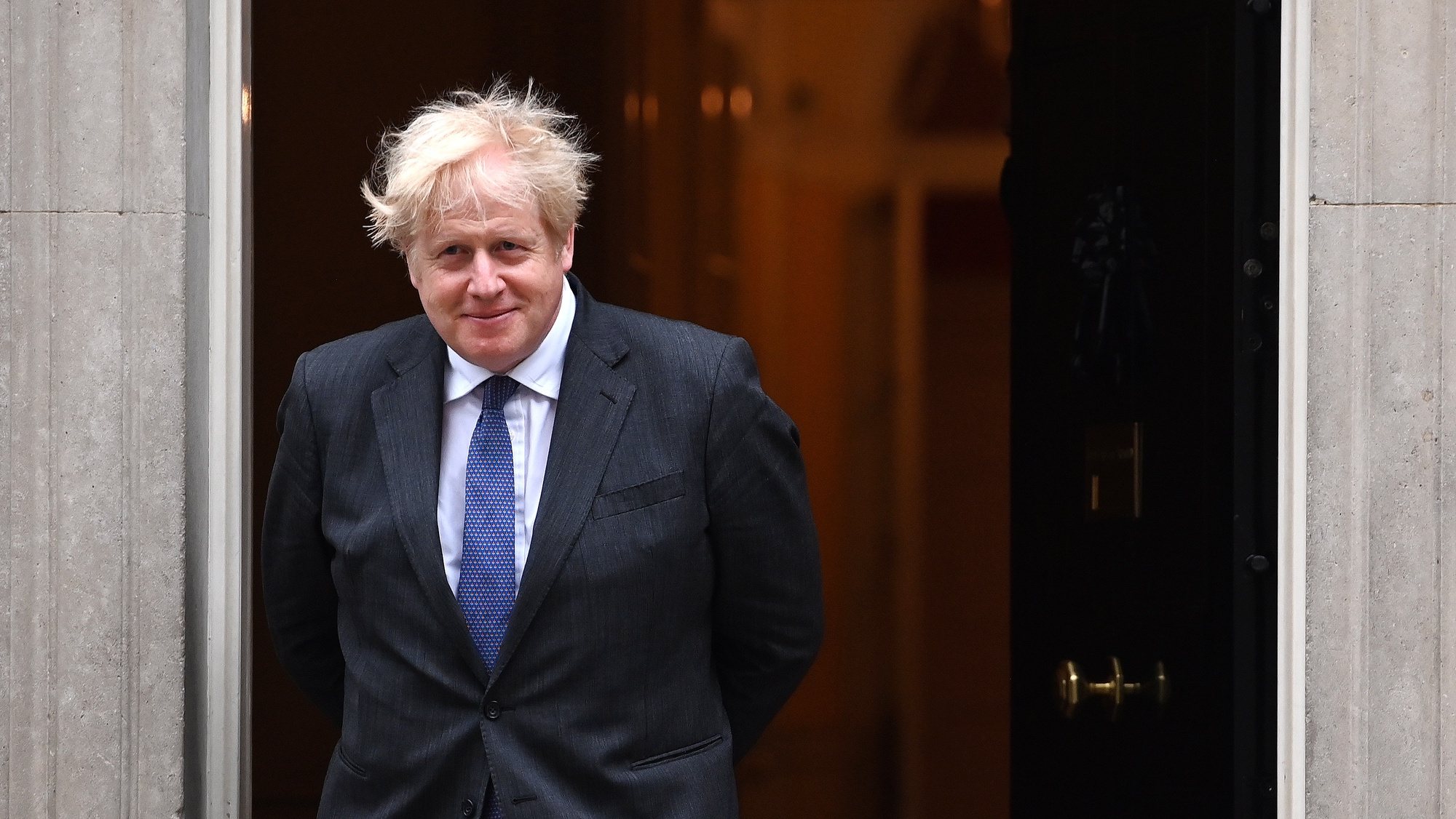 epa09278847 British Prime Minister Boris Johnson looks on ahead of a meeting with Crown Prince Salman bin Hamad Al Khalifa of Bahrain at 10 Downing Street in London, Britain, 17 June 2021.  EPA/ANDY RAIN
