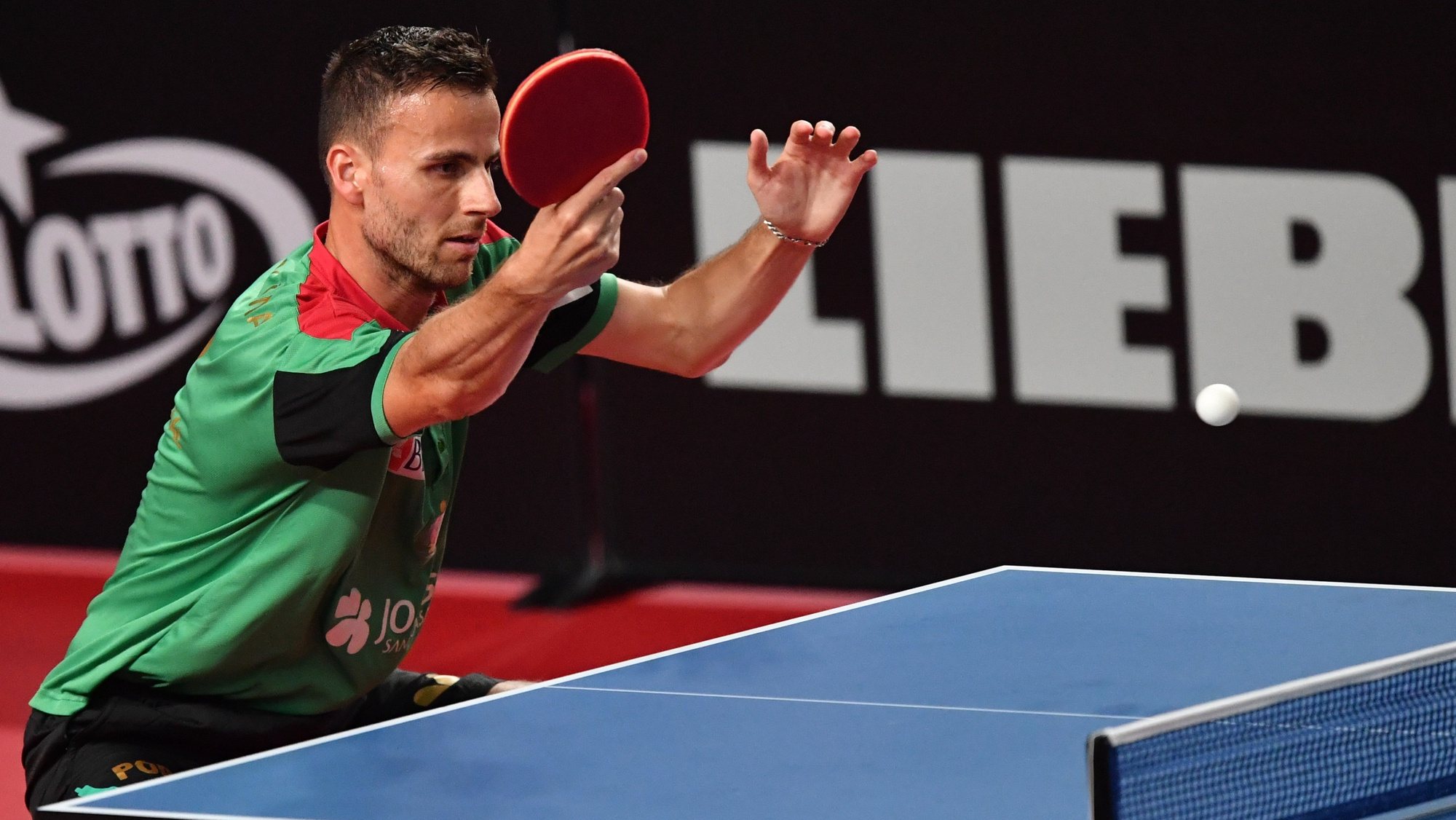 epa09301850 Tiago Apolonia of Portugal in action against Jon Persson of Sweden in the men&#039;s singles qualifiers during the ITTF European Table Tennis Championships 2020 in Warsaw, Poland, 25 June 2021.  EPA/Piotr Nowak POLAND OUT