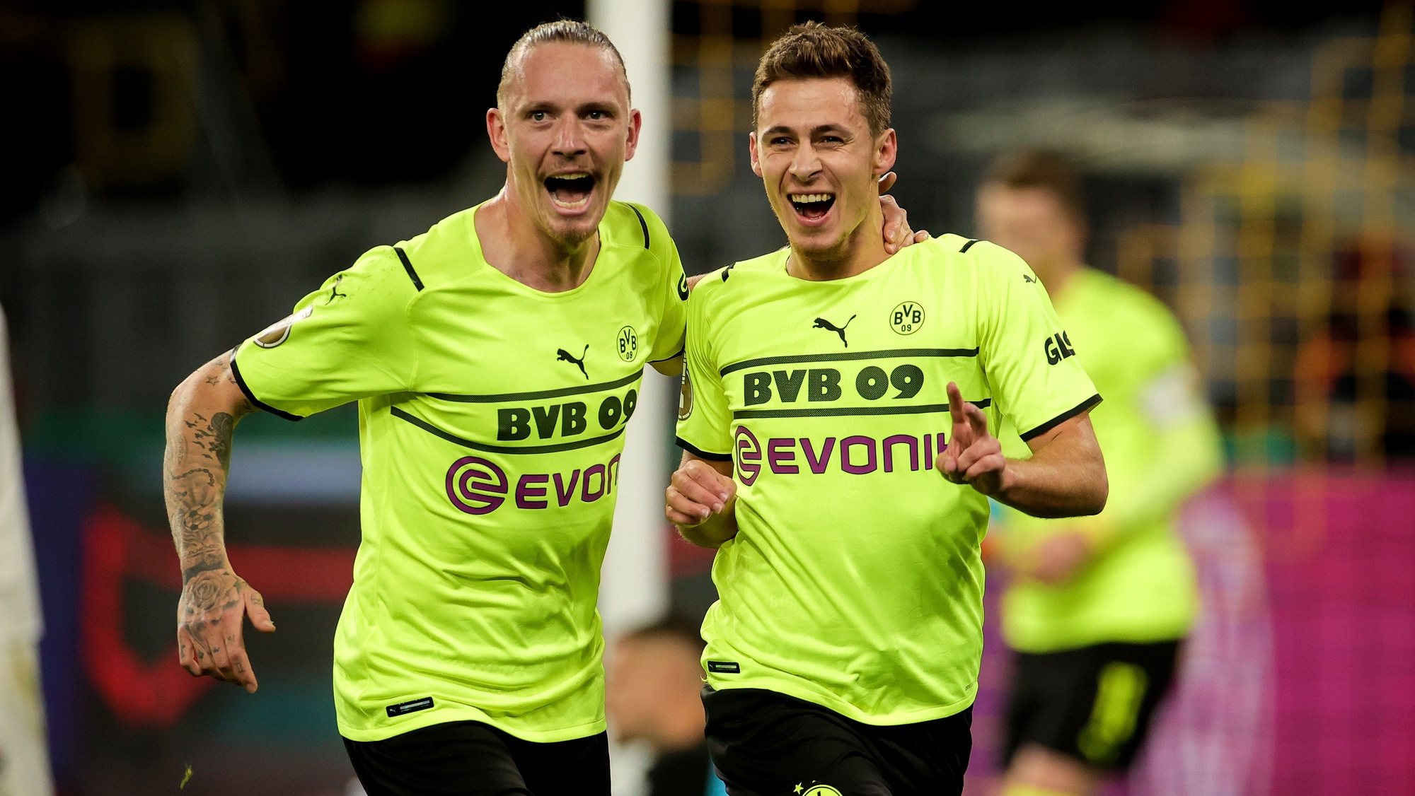 epa09547718 Dortmund&#039;s Thorgan Hazard (R) celebrates with his teammate Marius Wolf (L) after scoring the 2-0 lead during the German DFB Cup second round soccer match between Borussia Dortmund and FC Ingolstadt in Dortmund, Germany, 26 October 2021.  EPA/FRIEDEMANN VOGEL CONDITIONS - ATTENTION: The DFB regulations prohibit any use of photographs as image sequences and/or quasi-video.