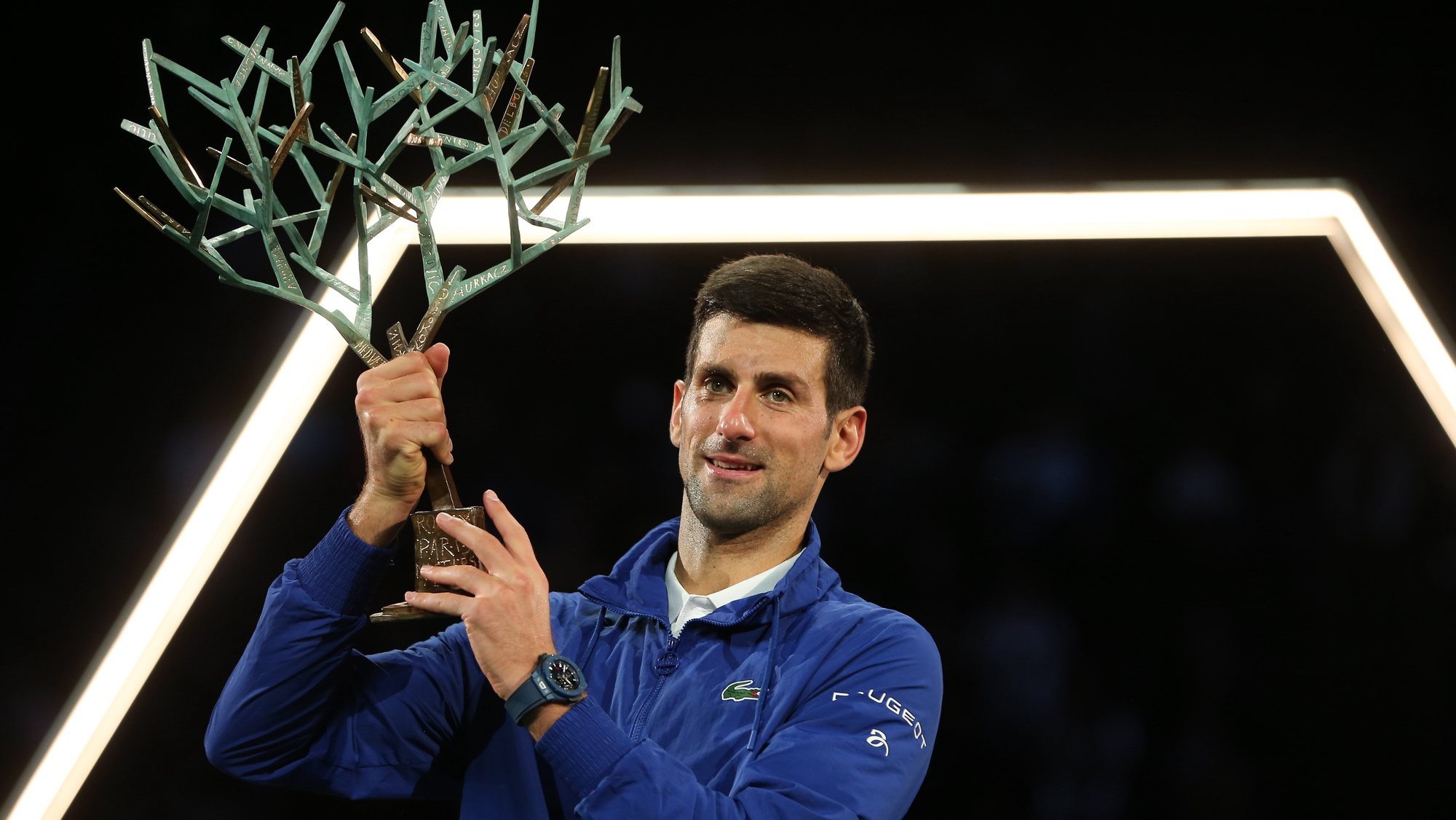 epa09570182 Novak Djokovic of Serbia celebrates with the trophy after winning the final match against Daniil Medvedev of Russia at the Rolex Paris Masters tennis tournament in Paris, France, 07 November 2021.  EPA/CHRISTOPHE PETIT TESSON