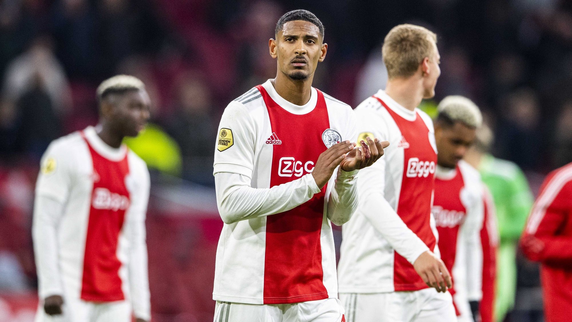 epa09570572 Sebastien Haller of Ajax greets supporters at the end of the Dutch Eredivisie soccer match between Ajax Amsterdam and Go Ahead Eagles at the Johan Cruijff ArenA  in Amsterdam, Netherlands, 07 November 2021.  EPA/OLAF KRAAK